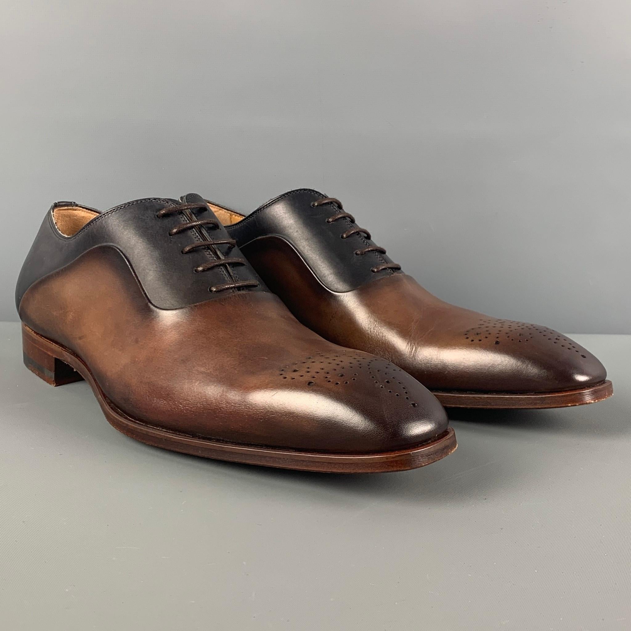 MAGNANNI shoes comes in a black & brown ombre leather featuring a square toe, perforated, and a lace up closure. Includes box. Made in Spain.

Very Good Pre-Owned Condition.
Marked: 20282 8.5 M
Original Retail Price: $498.00

Outsole: 12 in. x 4 in.
