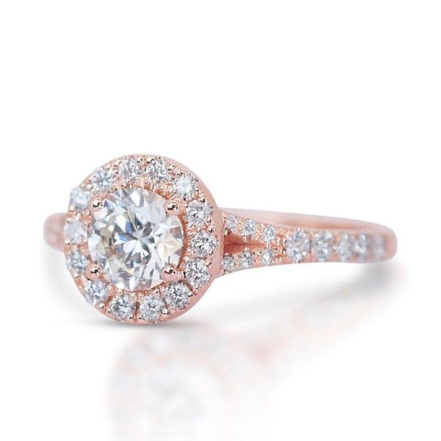 This isn't just a ring; it's a timeless promise of dazzling elegance. A magnificent 0.7-carat round brilliant diamond takes center stage, its G-H color radiating refined brilliance, enhanced by VS2-SI1 clarity that whispers a story of strength and