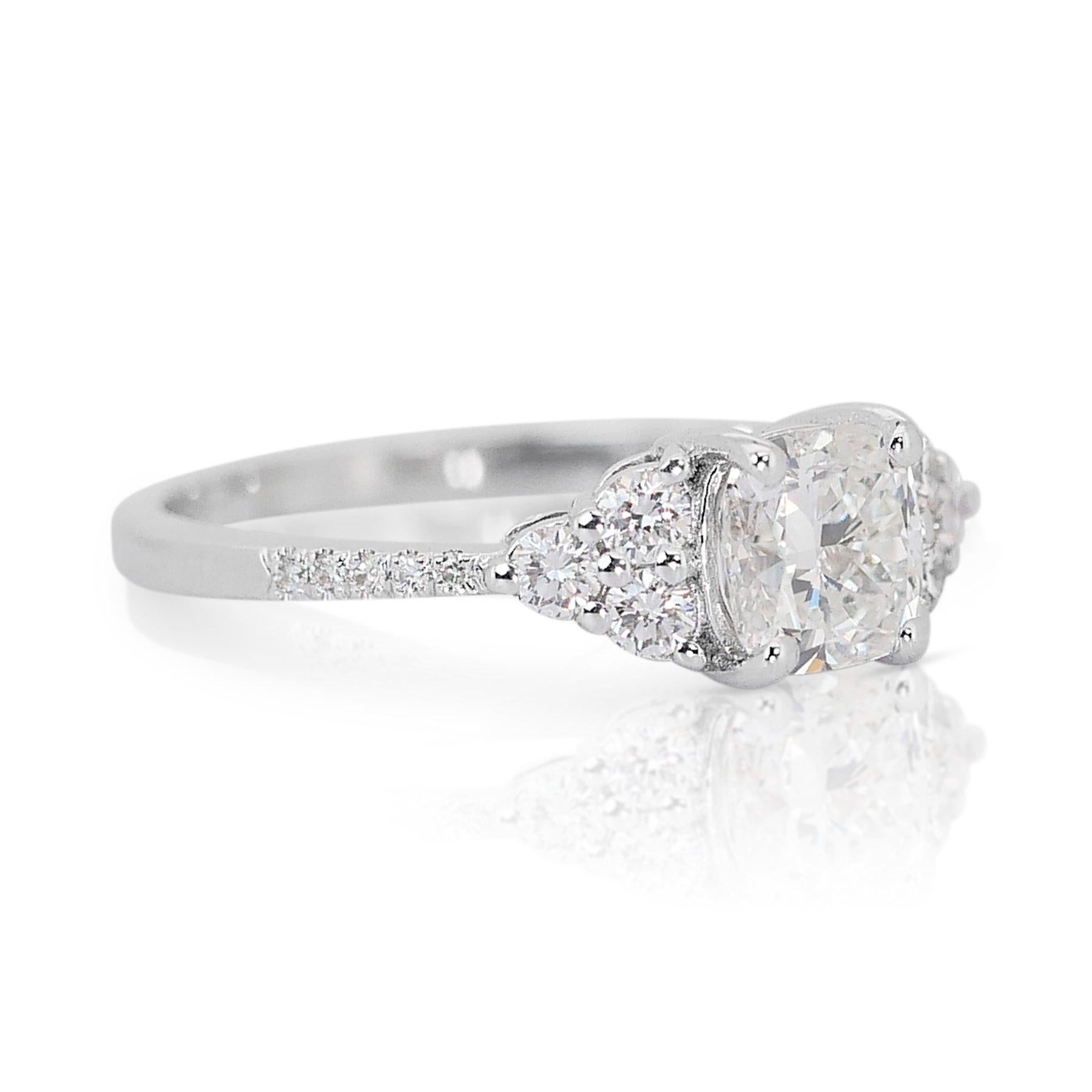 Magnificent 1.30ct Diamonds Pave Ring in 14k White Gold - GIA Certified

This magnificent ring crafted in 14k white gold epitomizes sophistication and purity, featuring a 1.00-carat cushion-cut main diamond that radiates unmatched brilliance.