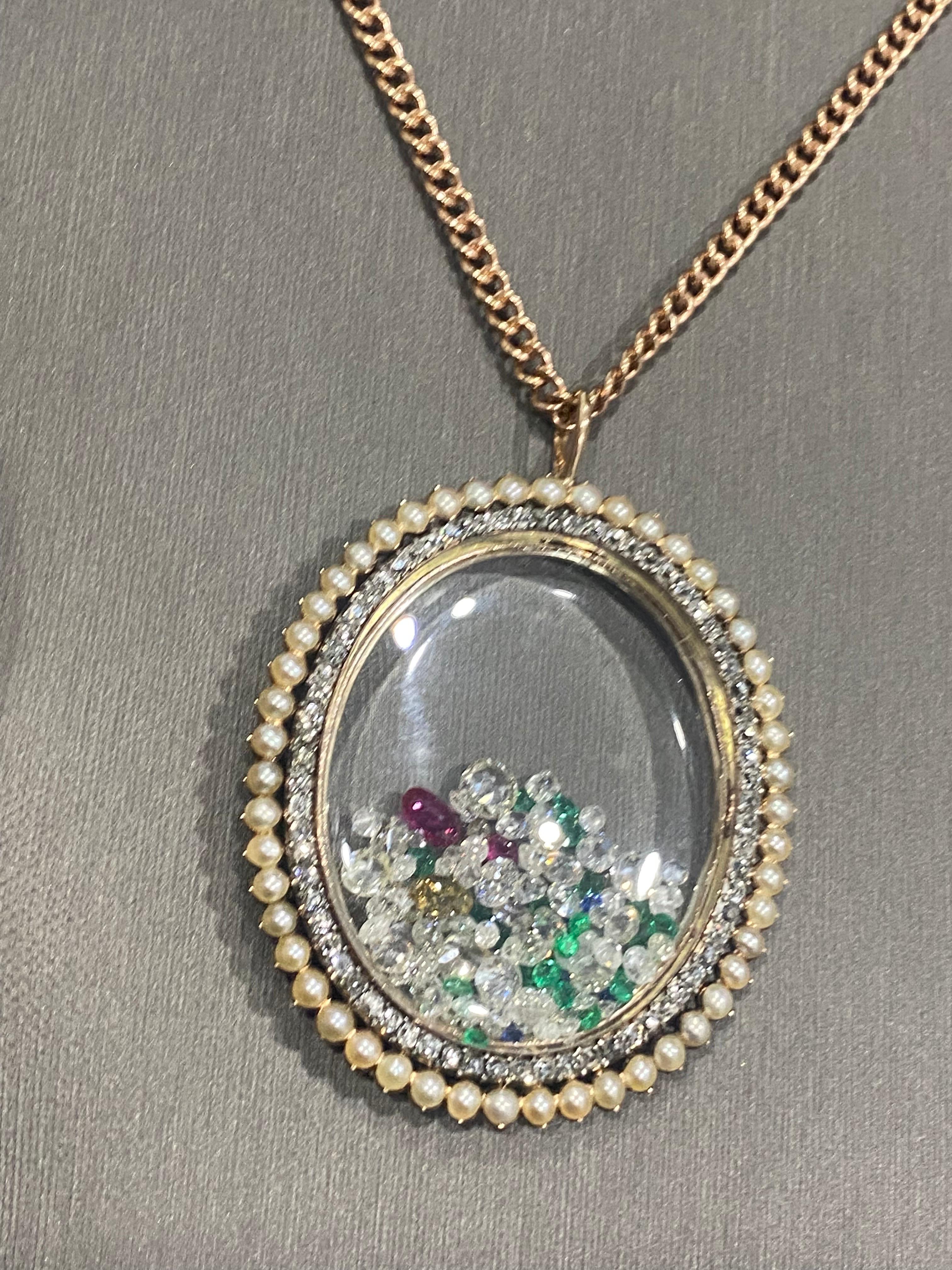 One of our newest favorite creations. A one-of-a-kind treasure. The large oval shaped oldeuropeancut diamond (2.50 CTW) and 50 pearls surround this locket derived from the Victorian Period, Circa 1880’s. 
It has been transformed into a Chic, elegant