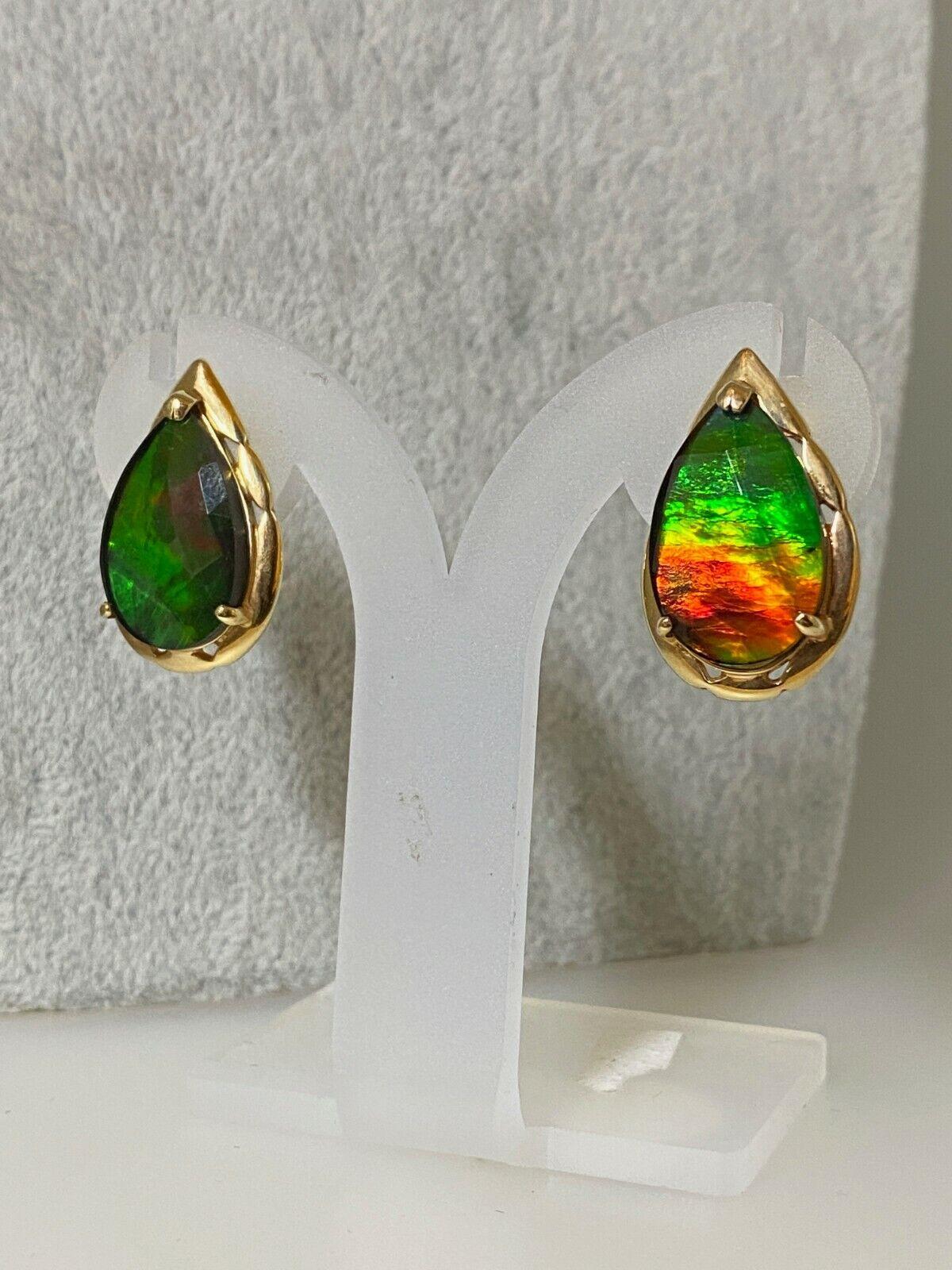 Finely crafted in 14K Yellow Gold (stamped 585), 
this impressive Pair of Earrings is dating from 1960's. 

Featuring secure omega backings, 
each is set with a drop-shaped faceted Ammolite, 
of AA gem grade 



Ammolite is a rare material cut from