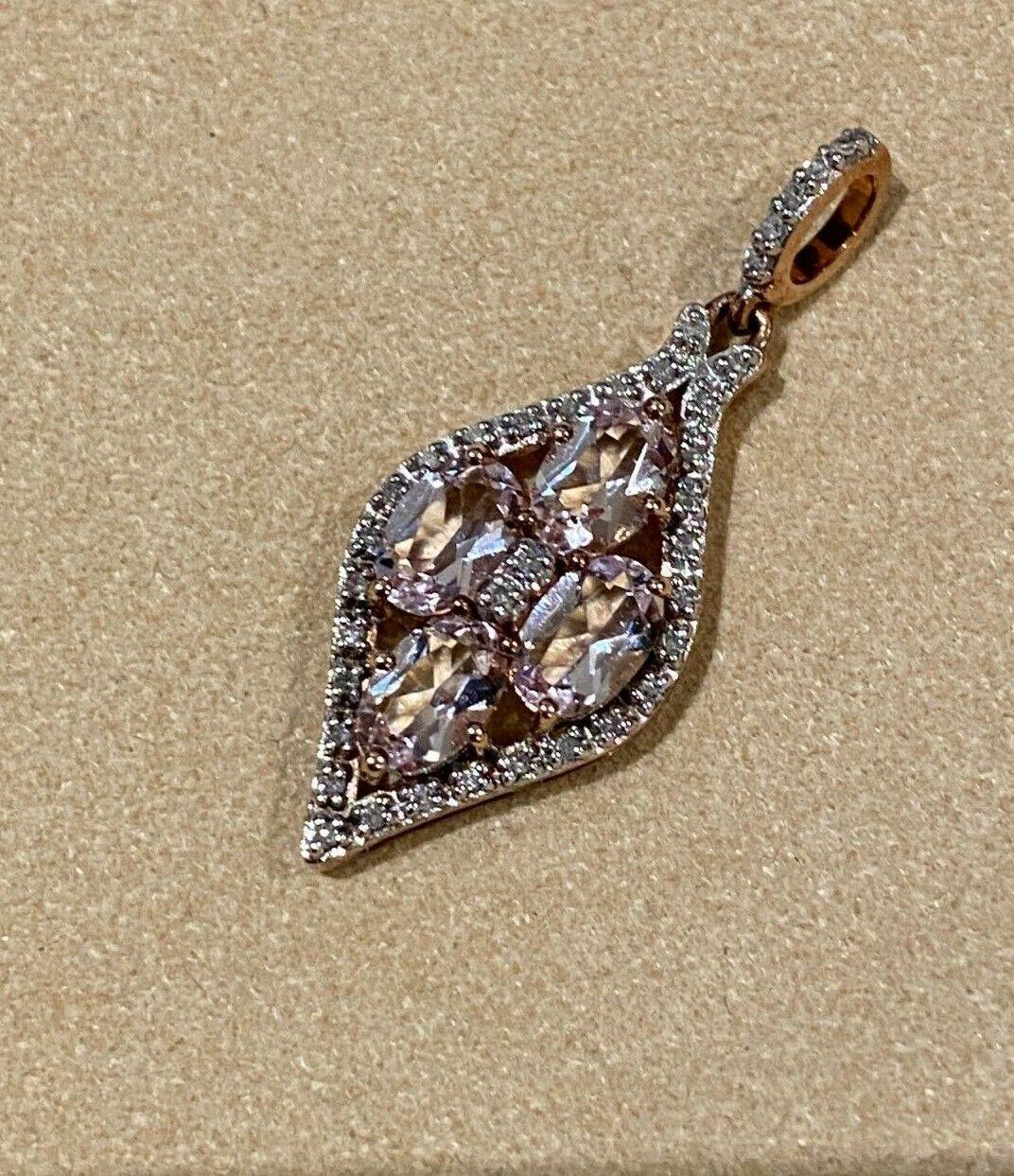 
Of superb flower design & elegant openwork motif, 
this vintage 1970's pendant 
is centering a gorgeous cluster of 4 Oval Natural Morganites 
(6mm x 4mm each)
of distinctive peachy pink colour 
& top clarity 
Of total combined weight of 1.60ct
