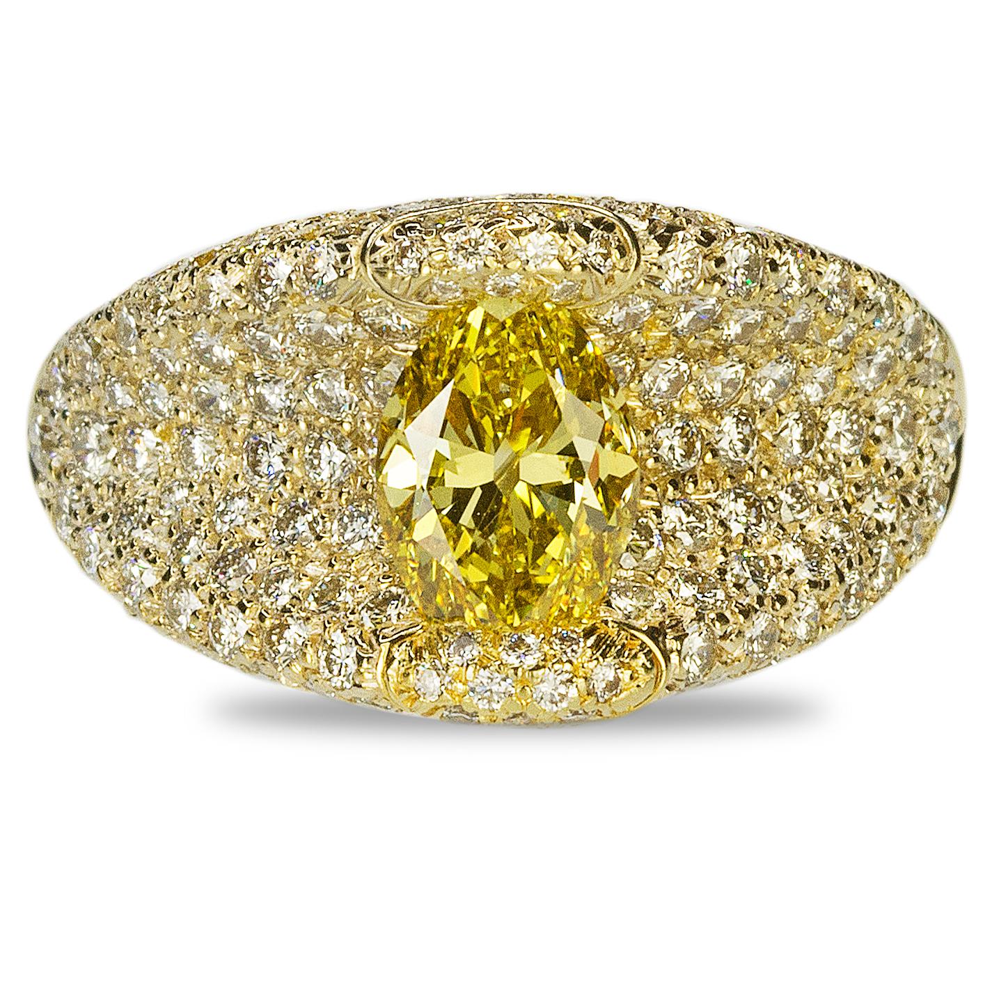 This Henry Dunay Ring might be the most beautiful piece of jewelry ever created. Front and center is a GIA certified Fancy Vivid Yellow, VVS1 clarity oval diamond weighing 1.47 carats and 188 round diamionds weighing approximately 3,50 carats. 
