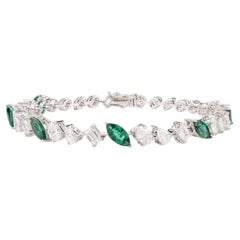 Magnificent 18 Karat White Gold Emerald and Diamond Tennis Bracelet