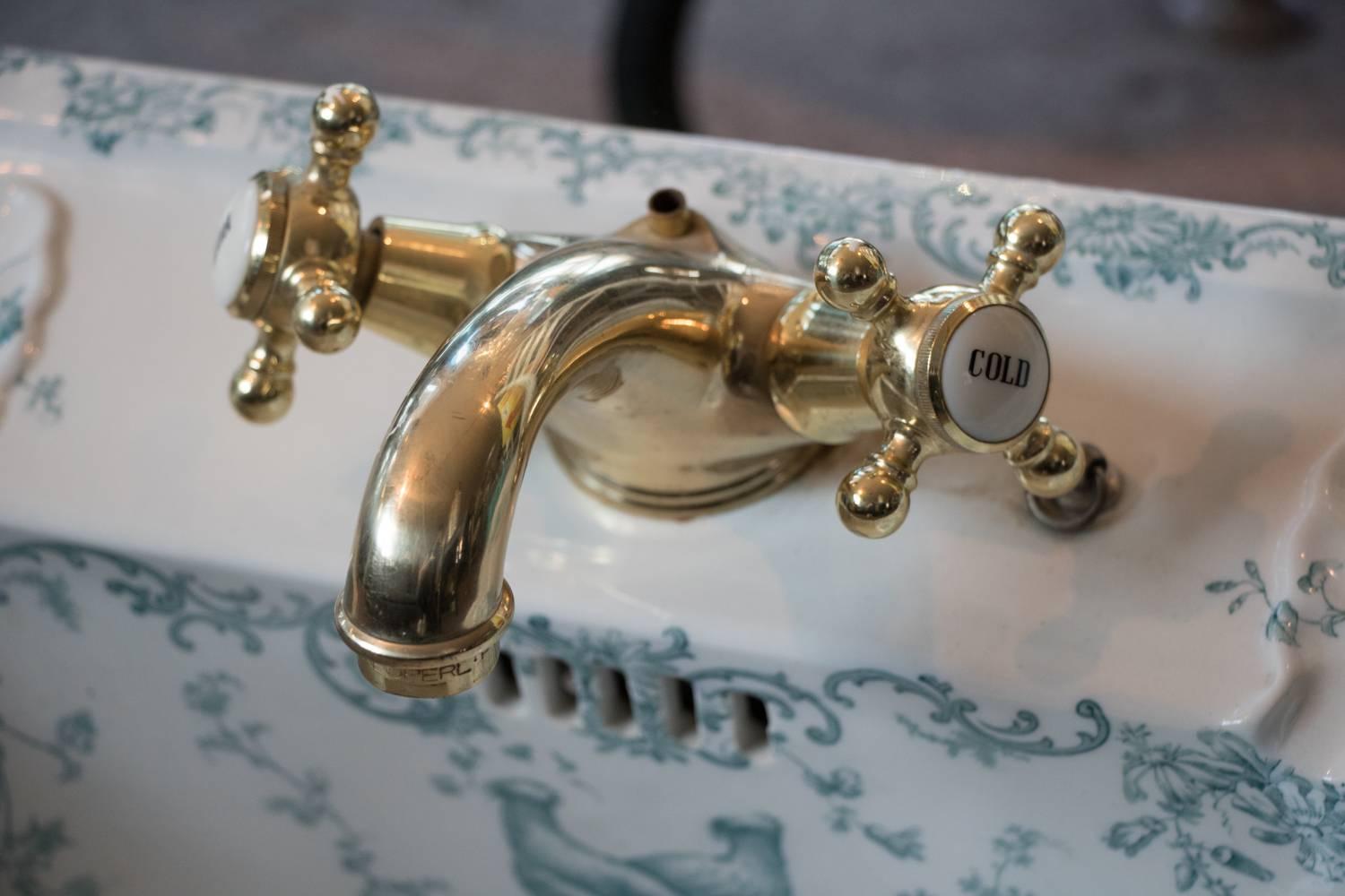Magnificent 1862-1904 hand-painted cauldon porcelain sink with brass fixtures robin's egg blue art. Old world fixtures with modern brass solid beautifully smooth white porcelain with hand painted design in robin's egg blue or florals and love