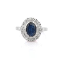Magnificent 18K White Gold Blue Sapphire and Halo Diamond Ring