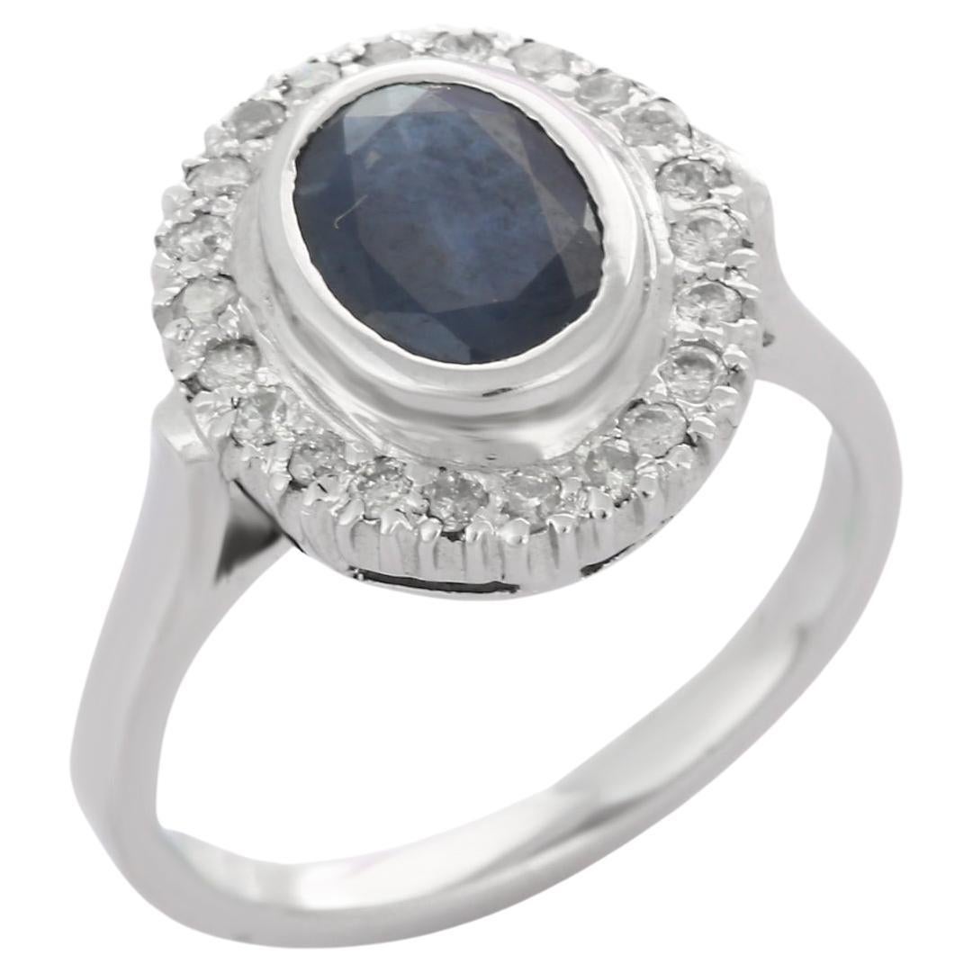 Magnificent 18K White Gold Blue Sapphire and Halo Diamond Ring