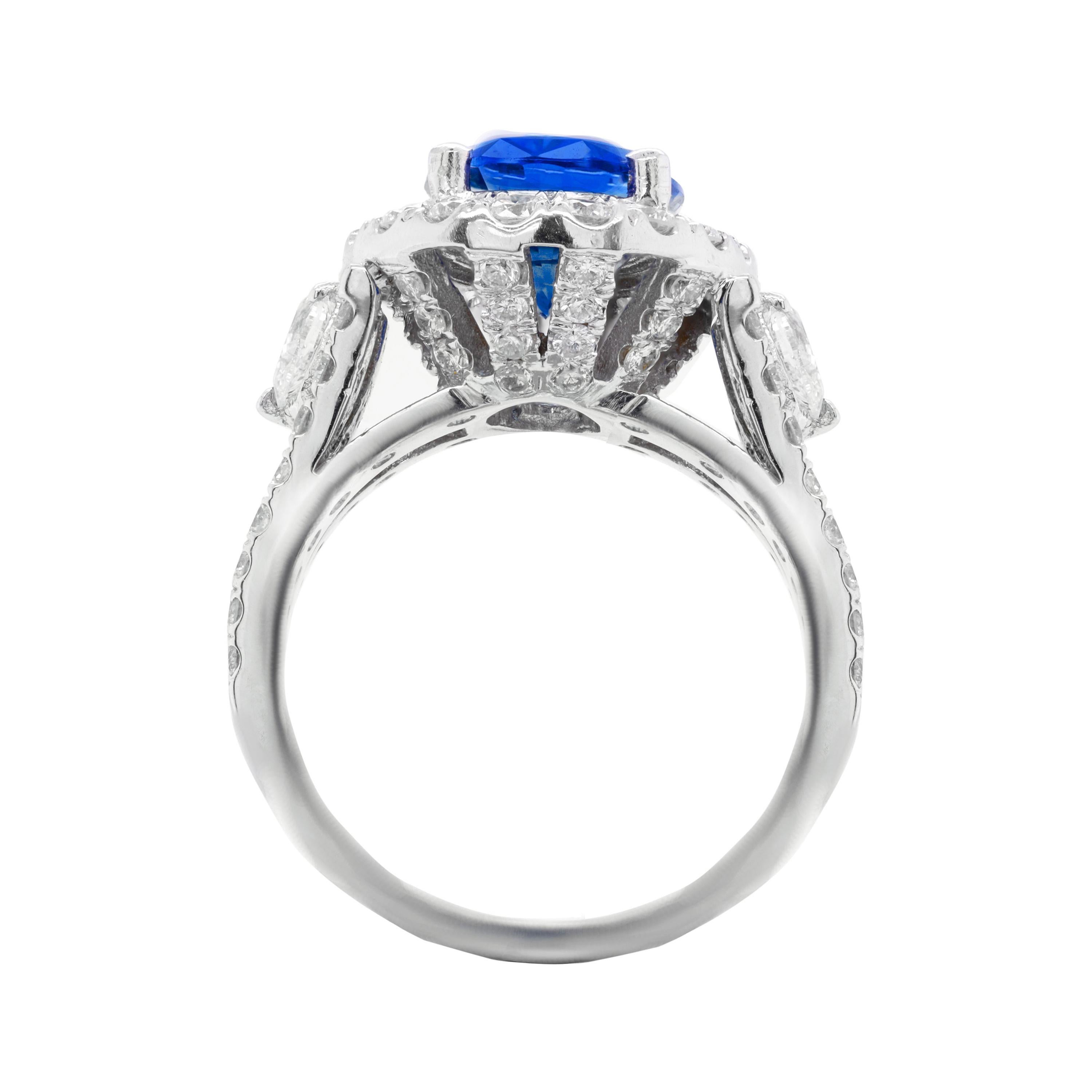 Magnificent 18kt gic certified blue sapphire diamond ring, 4.26ct sapphire set in diamond halo setting with two pear shape diamonds and micropave rd diamond total weight is 2.00ct
