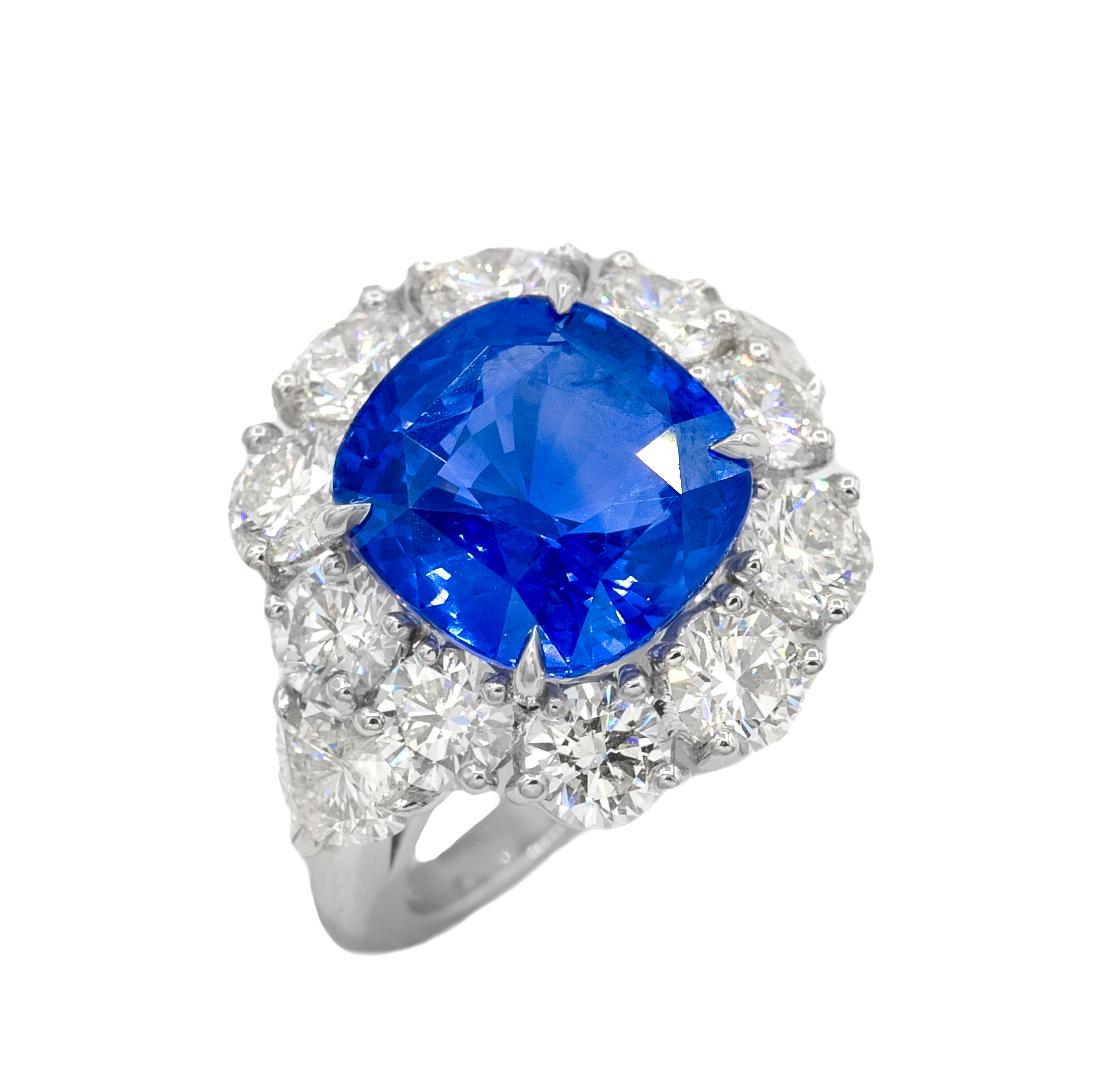 Magnificent 18kt GIC certified blue sapphire diamond ring, 4.26ct sapphire set in diamond halo setting with two pear shape diamonds and micropave rd diamond total weight is 2.00ct
