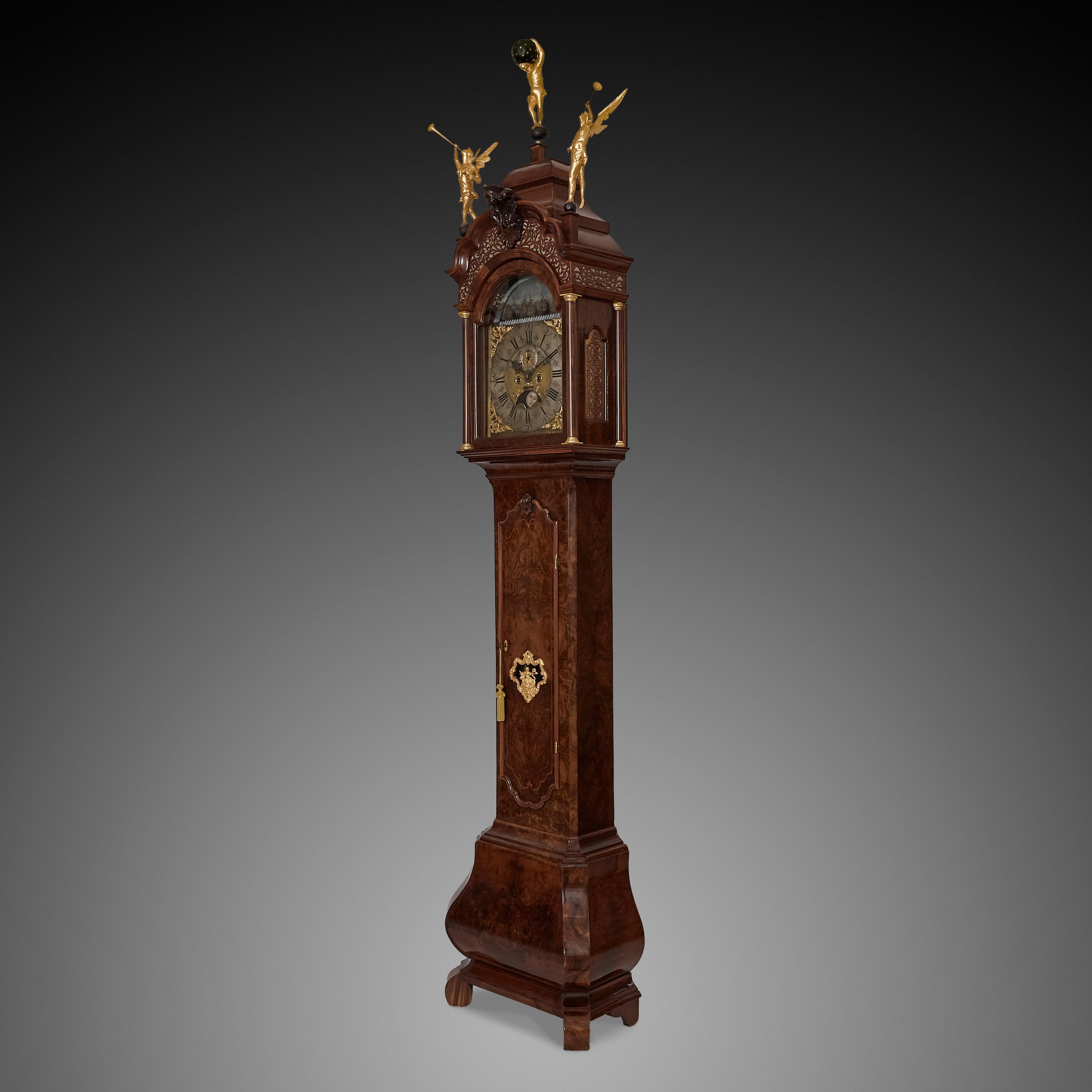An impressive Dutch longcase clock with a burr walnut veneered oak case, signed on the chapter ring F. VAN CEULEN UTRECHT. The hood of this clock has a broken arch top pediment with very fine elaborate fretwork functioning as sound frets, as well as