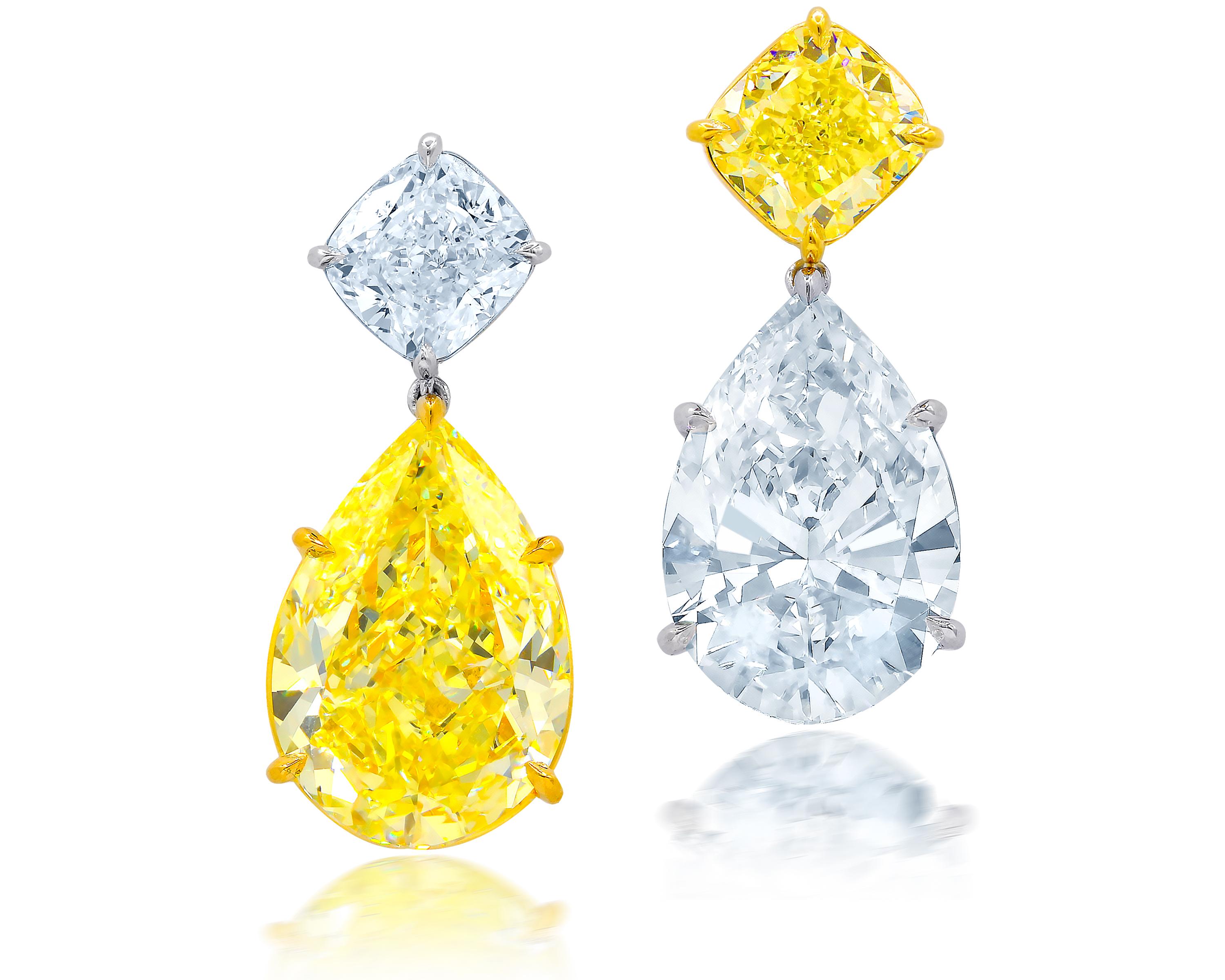 Magnificent 18tk and platinum diamond earrings with pear shape (psc293)14.73 fvs2 and (psc301)15.91 hanging on bottom and tops are  (radc826)4.00ct   cushion fancy intense yellow vs1 and 4.01ct  e vs2 cushion  (rads1052)
