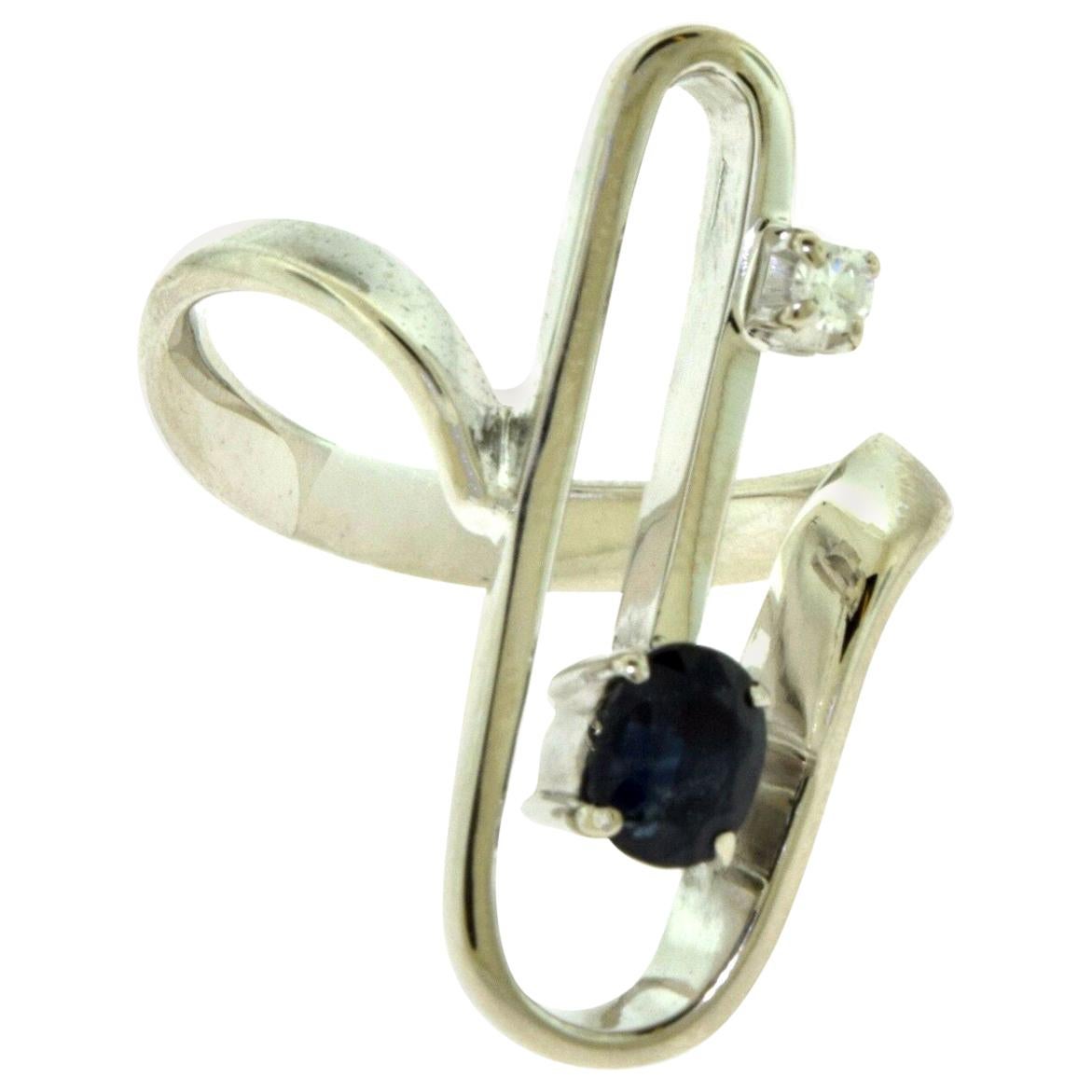 Magnificent 1970s Retro Sapphire and Diamond Paper Clip Ring For Sale