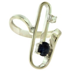 Magnificent 1970s Retro Sapphire and Diamond Paper Clip Ring