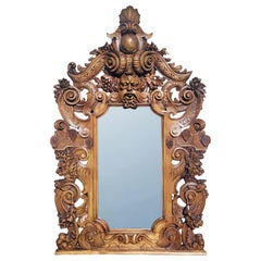 Magnífico espejo italiano del siglo XIX, de estilo barroco y con tallas en madera