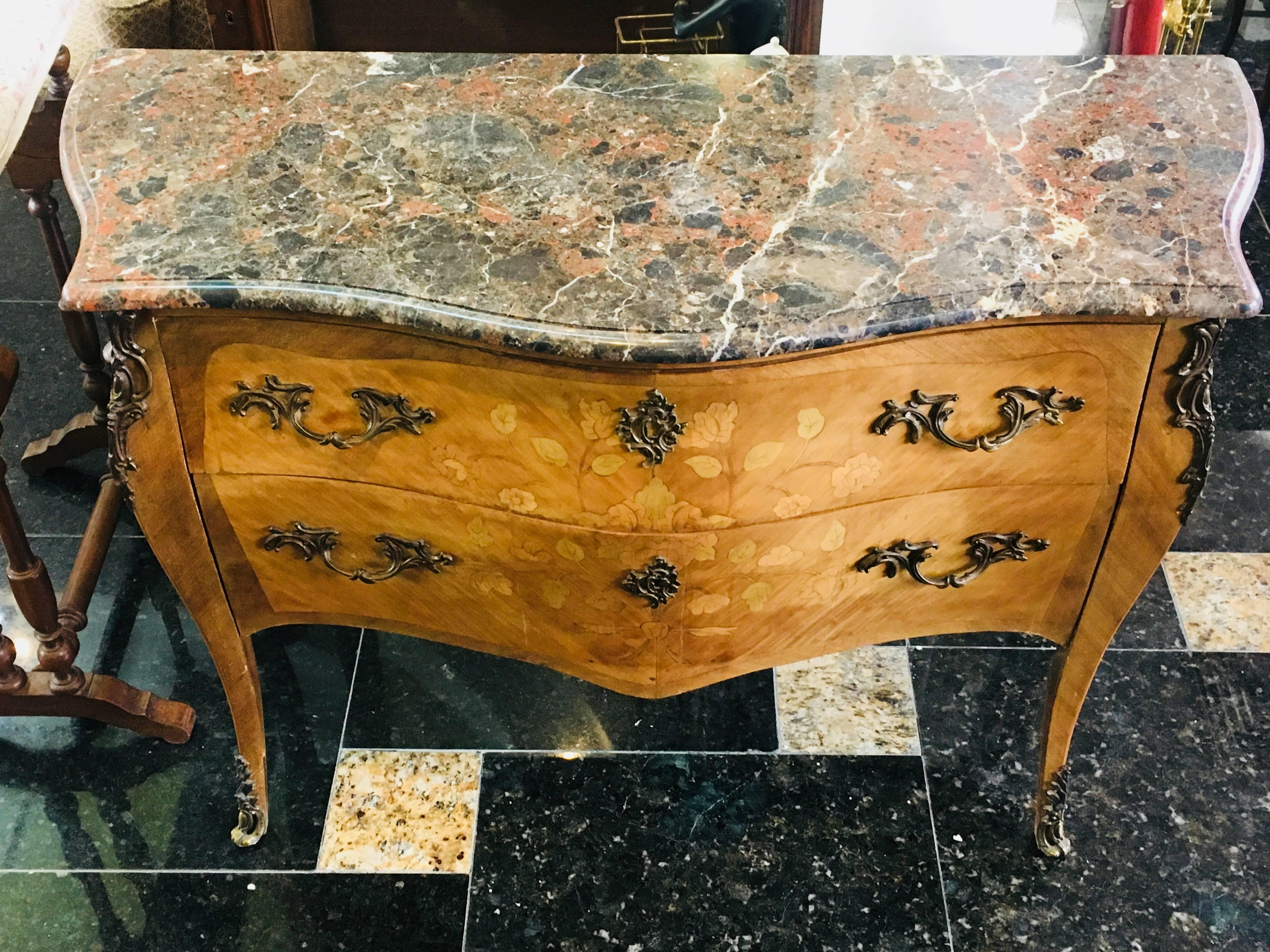 Magnificent 19th century marble-top two-drawer bombe commode from Paris, circa 1880. This commode is made from walnut and features exquisite floral marquetry decoration and original bronze handles and ornaments. Very good condition.