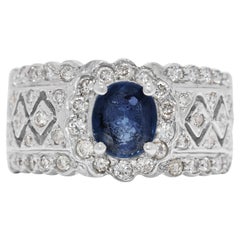 Magnifique bague en or blanc 18 carats ornée d
un saphir ovale de 1ct et d
un diamant naturel