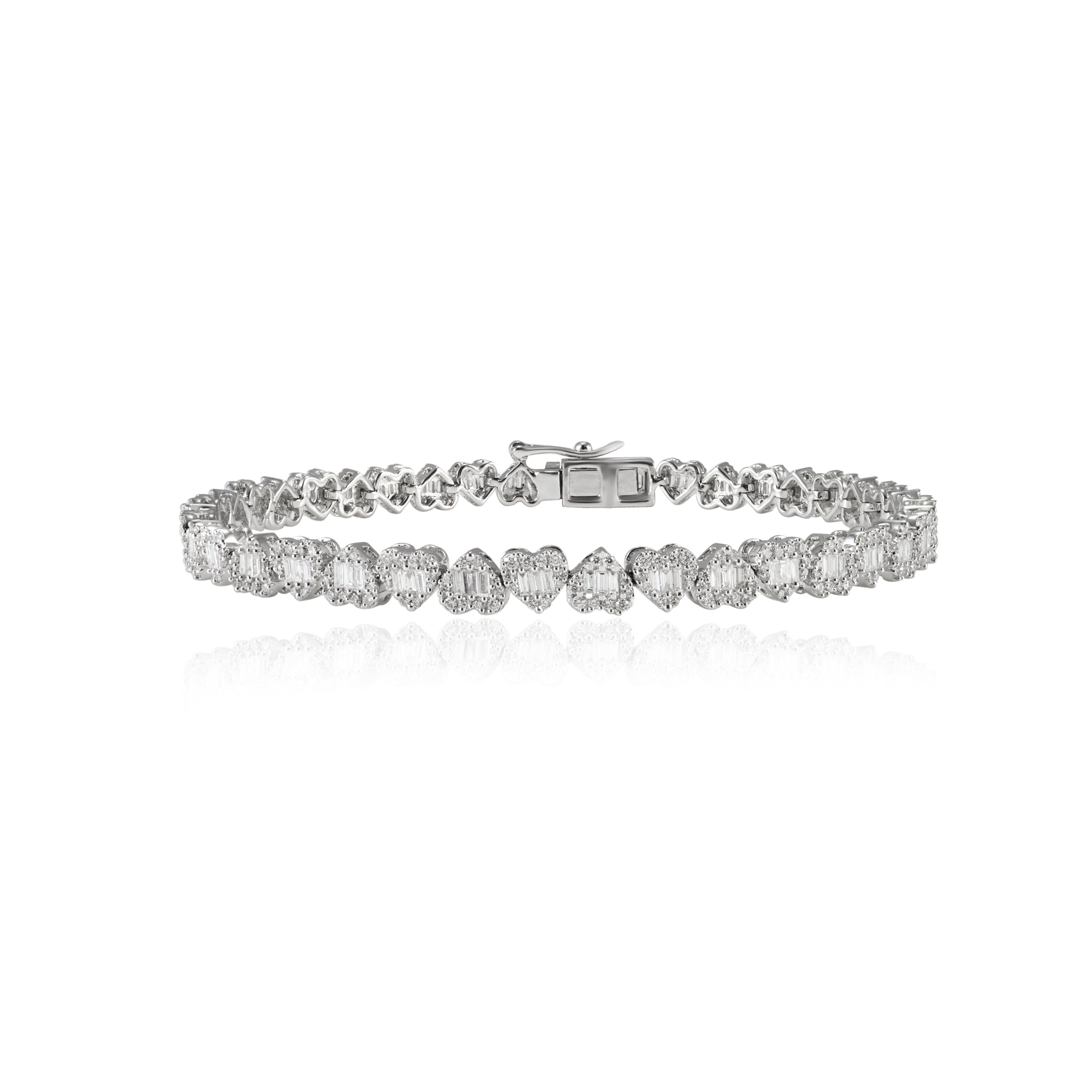 This Timeless Natural 2.11ct Diamond Heart Tennis Bracelet in 18K gold showcases sparkling natural diamonds, weighing 2.11 carats. 
April birthstone diamond brings love, fame, success and prosperity.
Designed with cluster of diamonds making heart,