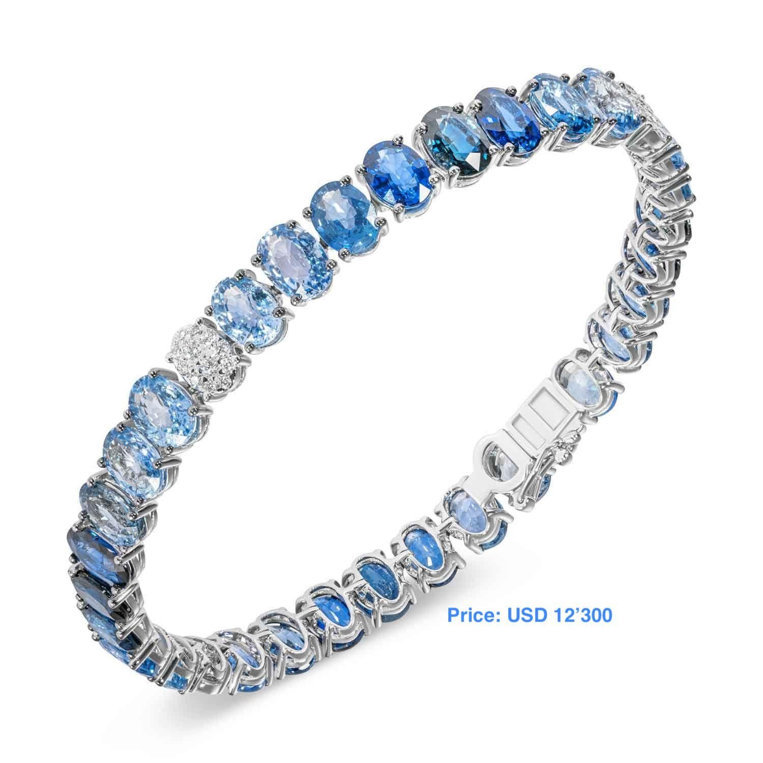 Armband Weißgold 14K
Gewicht - 20,15 Gramm
Größe  18,5 sm
Diamant 40-RND 57-0,33 ct
Blauer Saphir 4-Oval-2,35 ct 
Blauer Saphir 36-Oval-21,9 ct

NATKINA ist eine in Genf ansässige Schmuckmarke, die auf alte Schweizer Schmucktraditionen zurückblicken