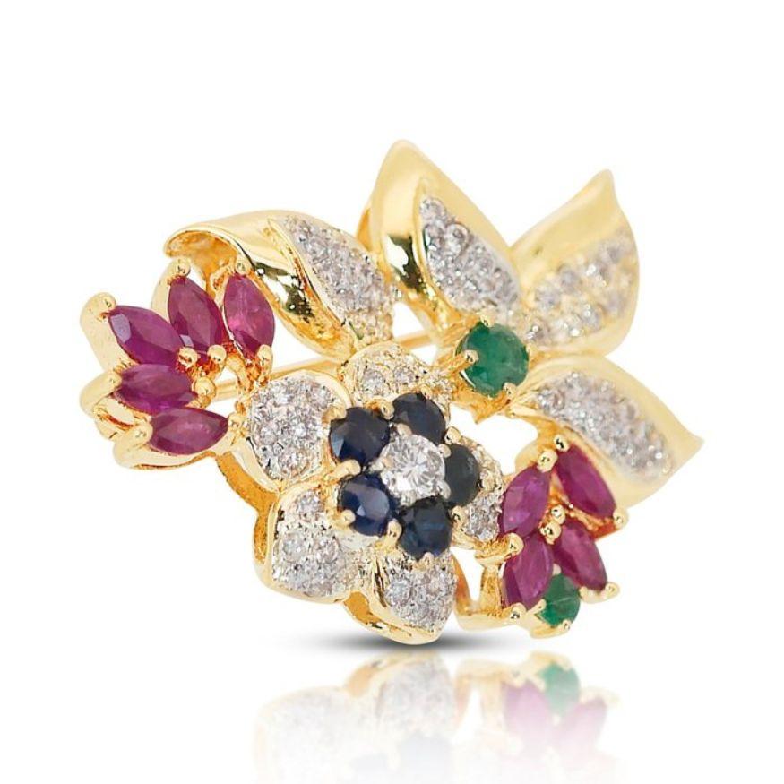 This magnificent brooch is a testament to elegance and sophistication, boasting a captivating array of gemstones that enchant the eye.

At its heart lies a cluster of 65 round brilliant-cut diamonds, totaling 1.03 carats. These diamonds, with a