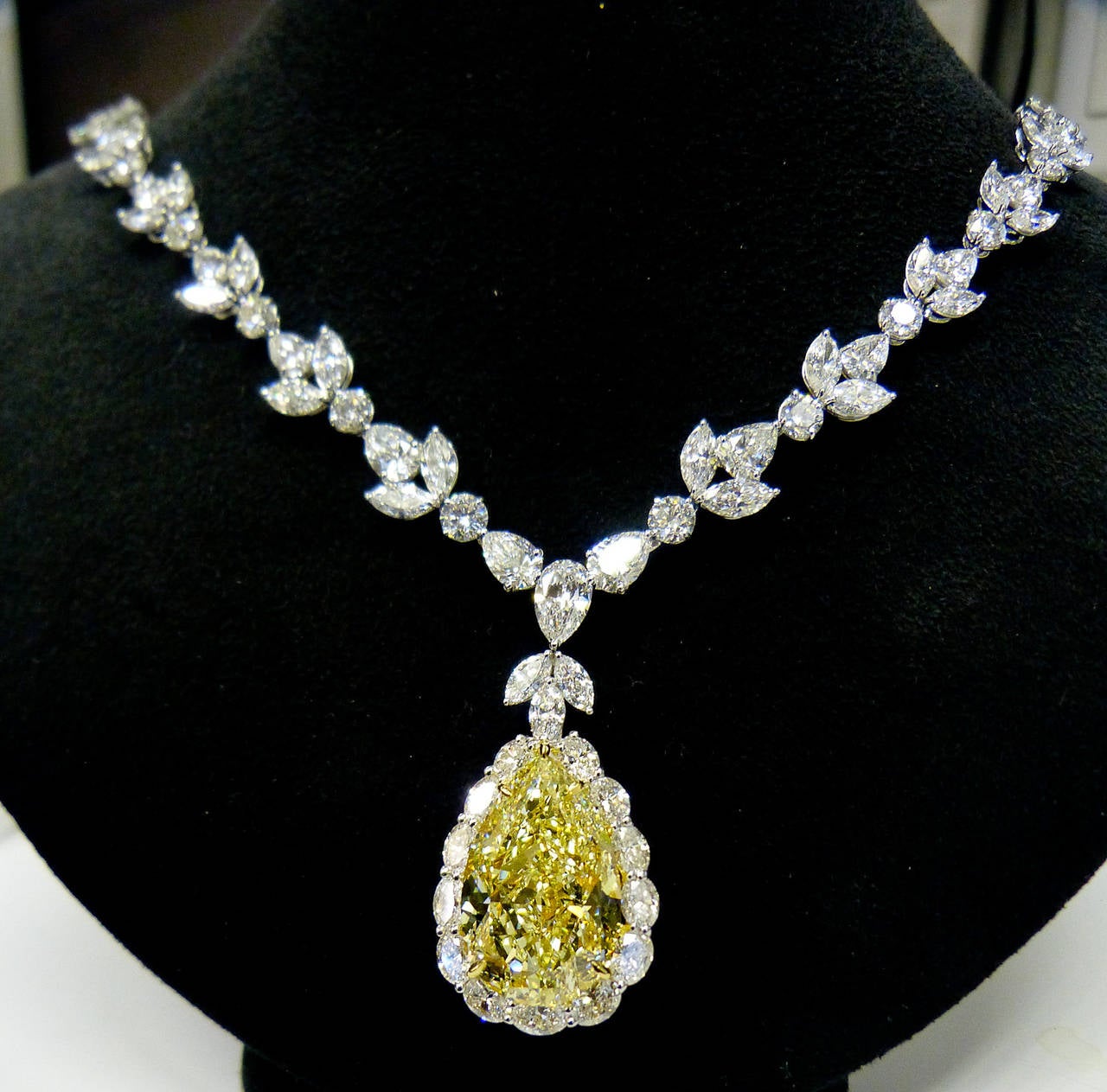 This absolutely stunning custom made necklace was created by Diana M. featuring 35.31 Carat Fancy Intense Yellow Pear Shape, one of the highest color grading, VS2 in Clarity. Surrounded by 47.00 carats of multi-shape diamonds, all D/E/F VVS/VS color