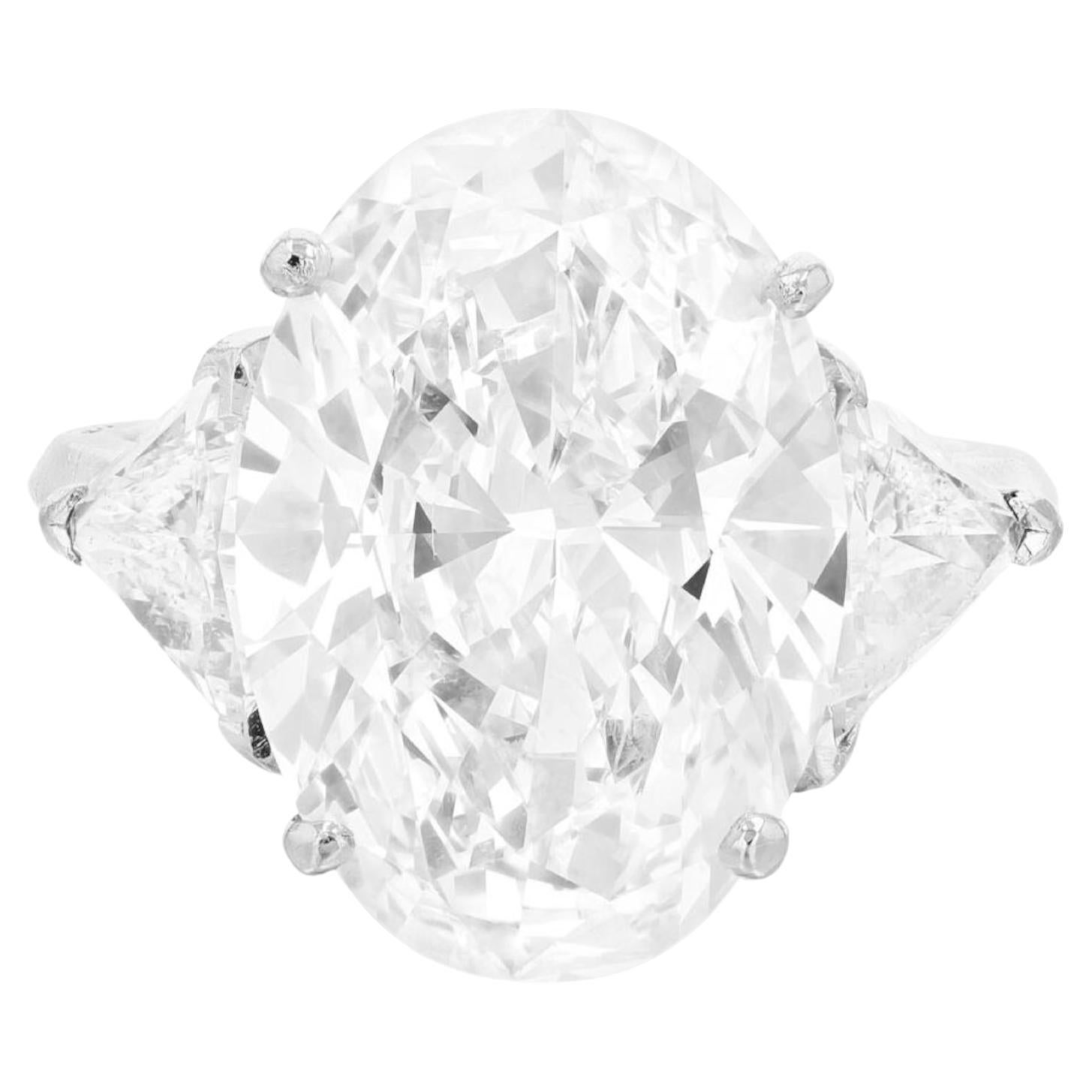 Magnificent 4 Carat Oval Brilliant Diamond Three-Stone Ring with Trillions
