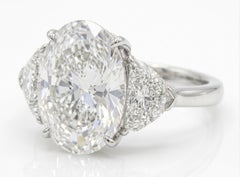 GIA Certified 4.01 Carat Oval Cut VVS2 Clarity Diamond Three Stone Platinum Ring