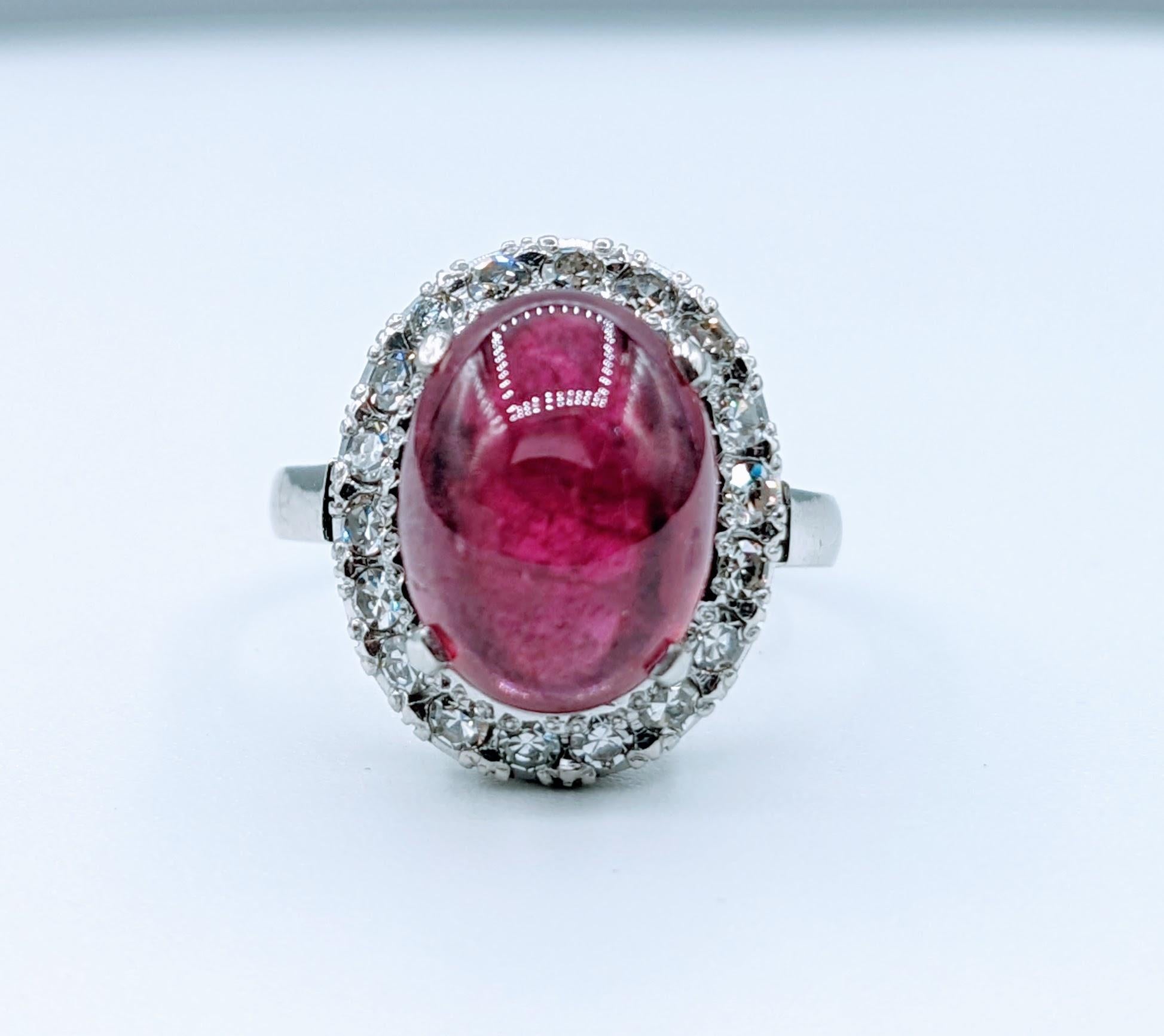 Magnificent 4.43ct Rubellite Cabochon Tourmaline & Diamond Platinum Ring

Presenting an exquisite jewelry masterpiece - a magnificent platinum ring embellished with a stunning 4.43 carat rubellite tourmaline and 1.5 carats of dazzling single cut