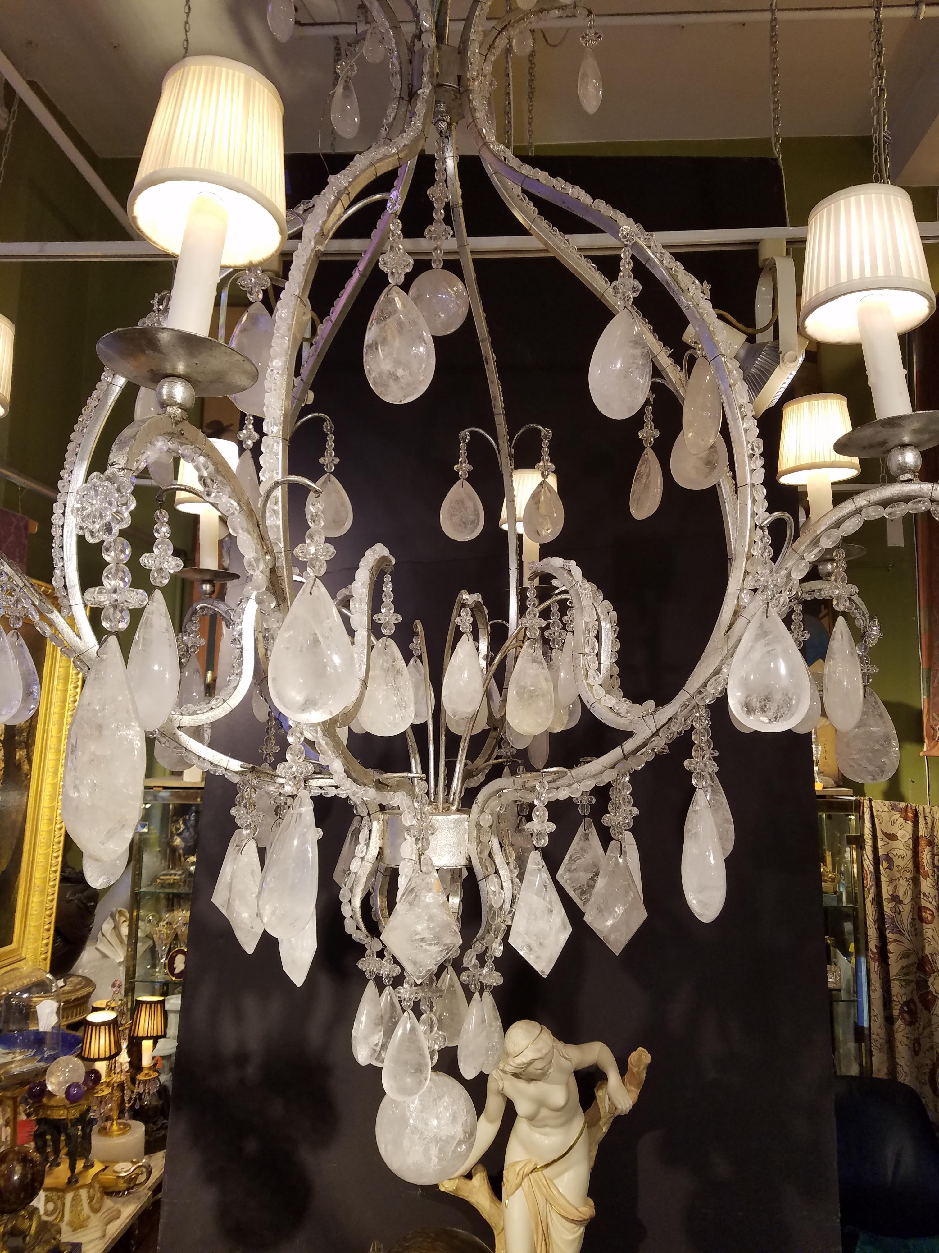 Natural rock crystal prisms mounted on silver- leaf wrought iron. Measures: 60