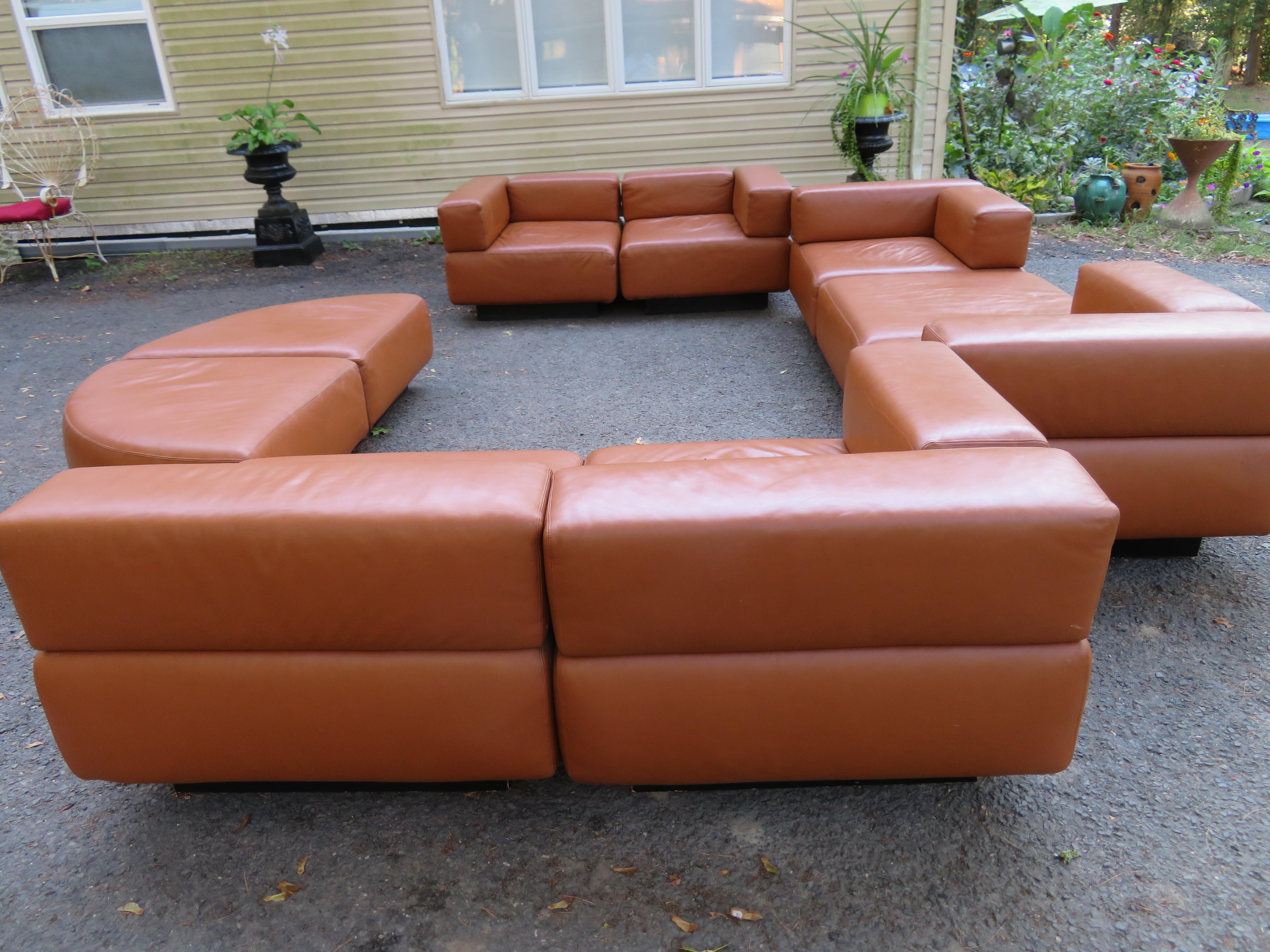 Harvey Probber caramel brown leather 'Cubo' sectional sofa nine sections of Harvey Probber designed 'CUBO' modular seating. Set includes six seating units and three ottomans. The sectional is easily positioned into a number of interesting