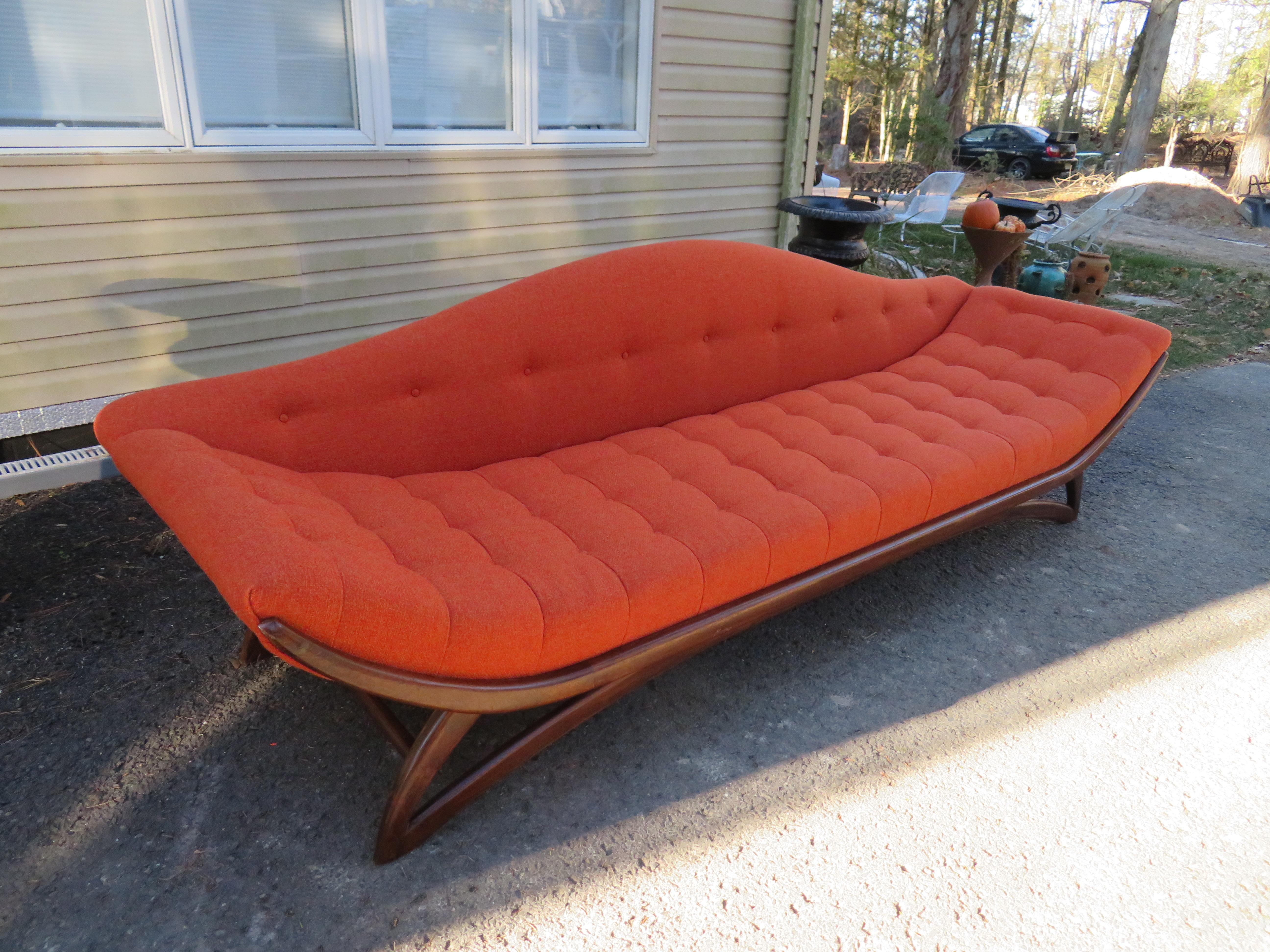 Magnificent Adrian Pearsall sculptural walnut gondola sofa. This wonderful sofa has been re-upholstered in a fabulous woven fabric call Sunkist Vibe and looks absolutely scrumptious! The walnut base has been reglued but still retains its original