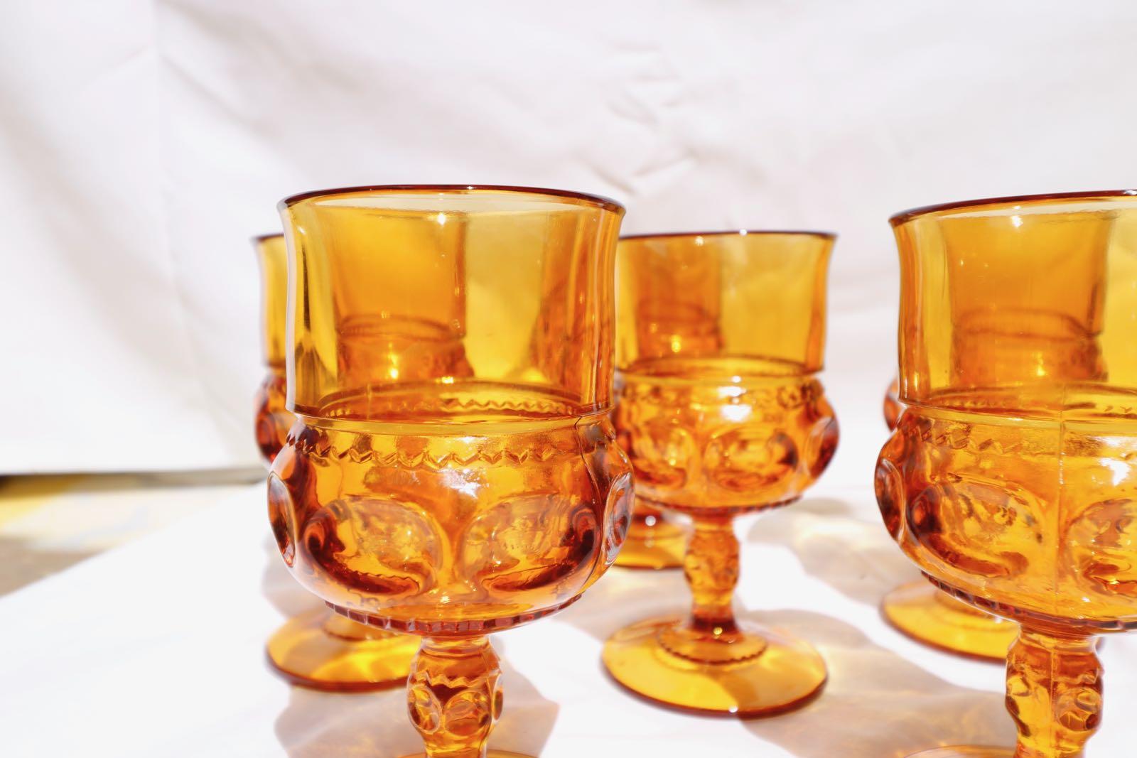 Magnificent amber glass 1960 midcentury amber glass water, wine or whisky set of six glasses. Depression goblets for a midcentury setting! The color of these glasses is magnificent! So beautiful with great detail in the glass.