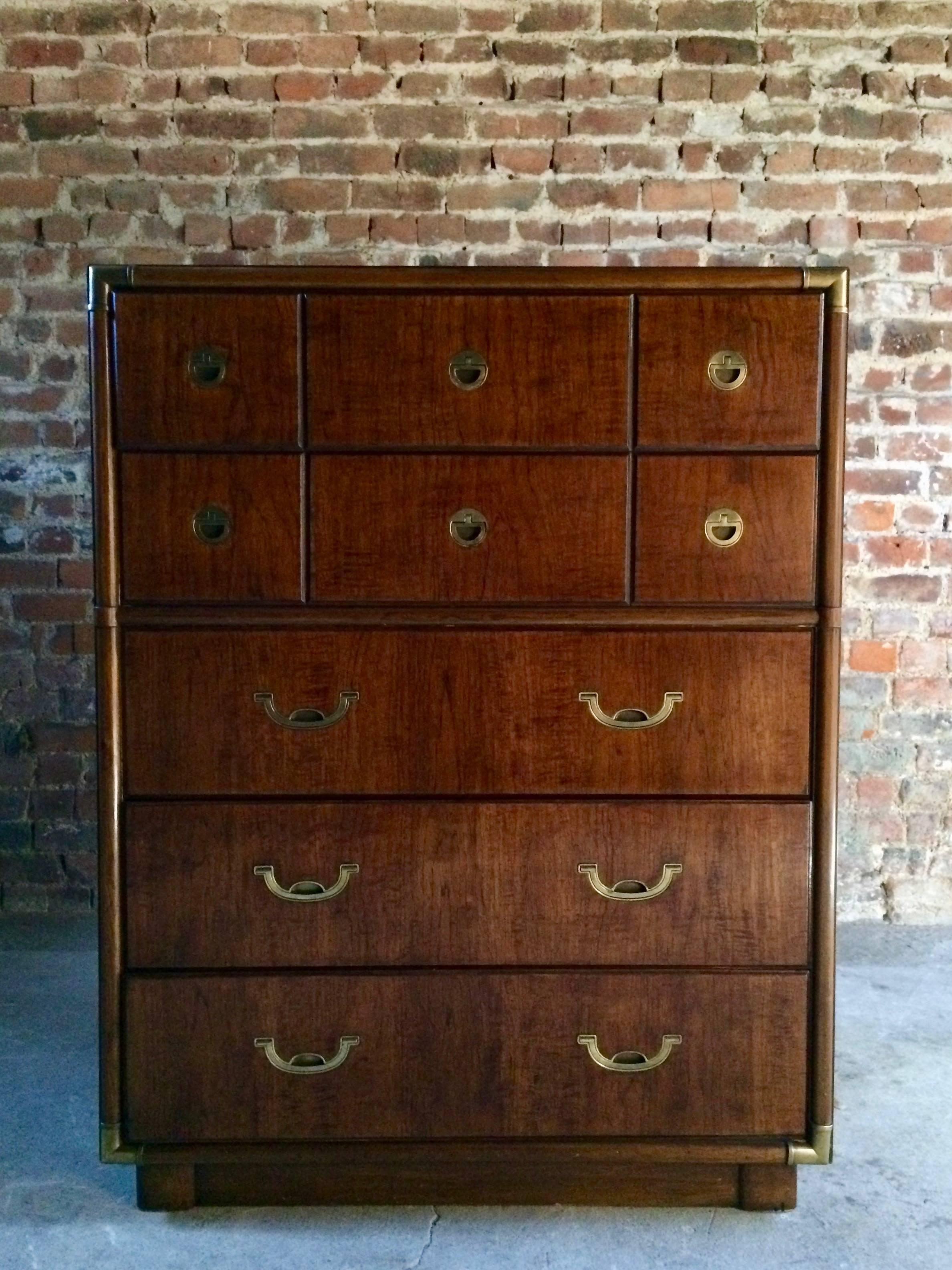 A magnificent midcentury Drexel Campaign chest of drawers made for its highly sought after Accolade collection, the rectangular top with brass corner fittings over five graduated drawers all made of solid wood construction and each with beautiful