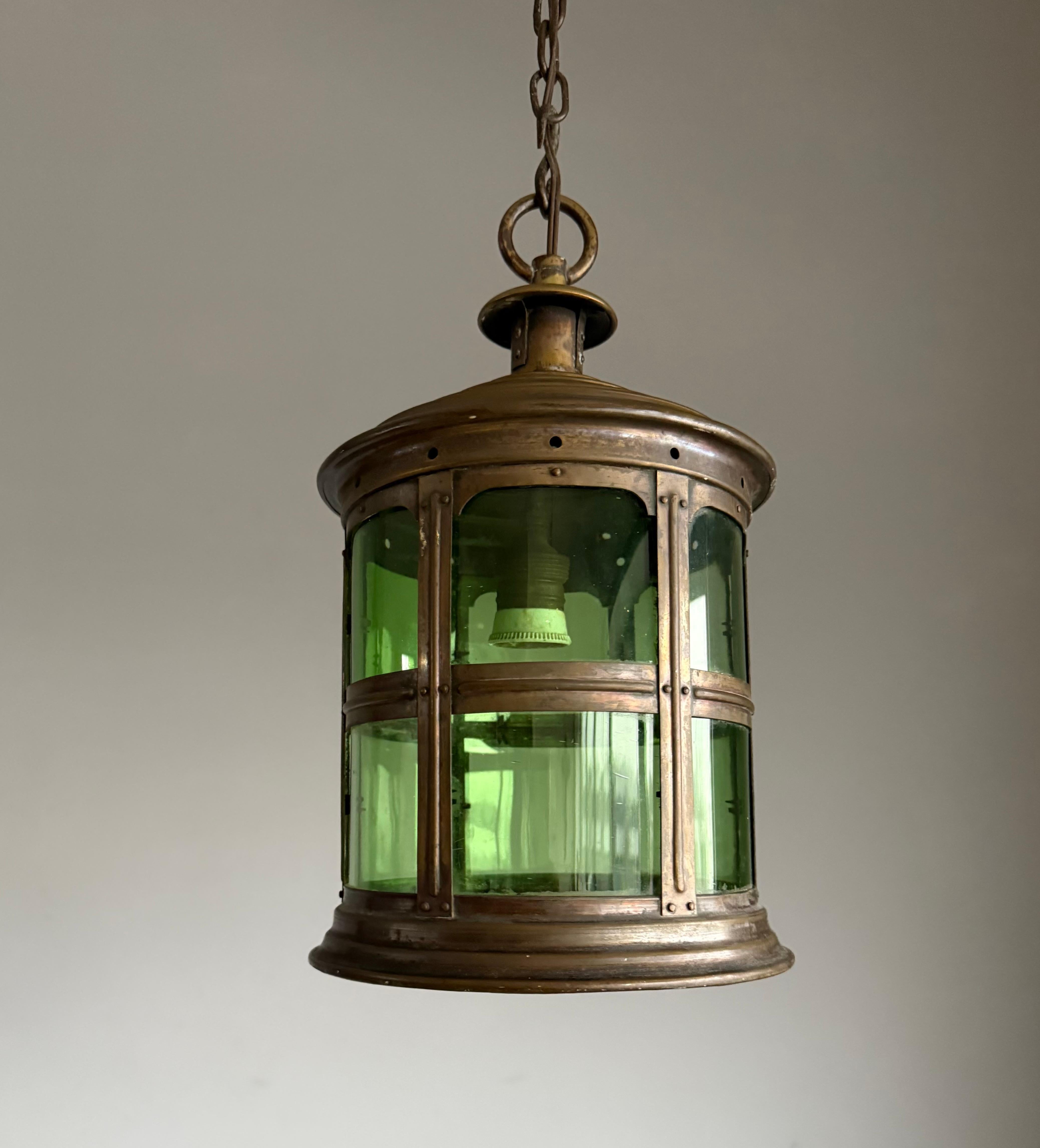 Perfect size Antique, Arts and Crafts hallway pendant with 12 curved art glass panels.

If you are looking for a stylish and quality crafted antique lantern to grace your entry hall, stairwell or landing then this Arts & Crafts beauty could be