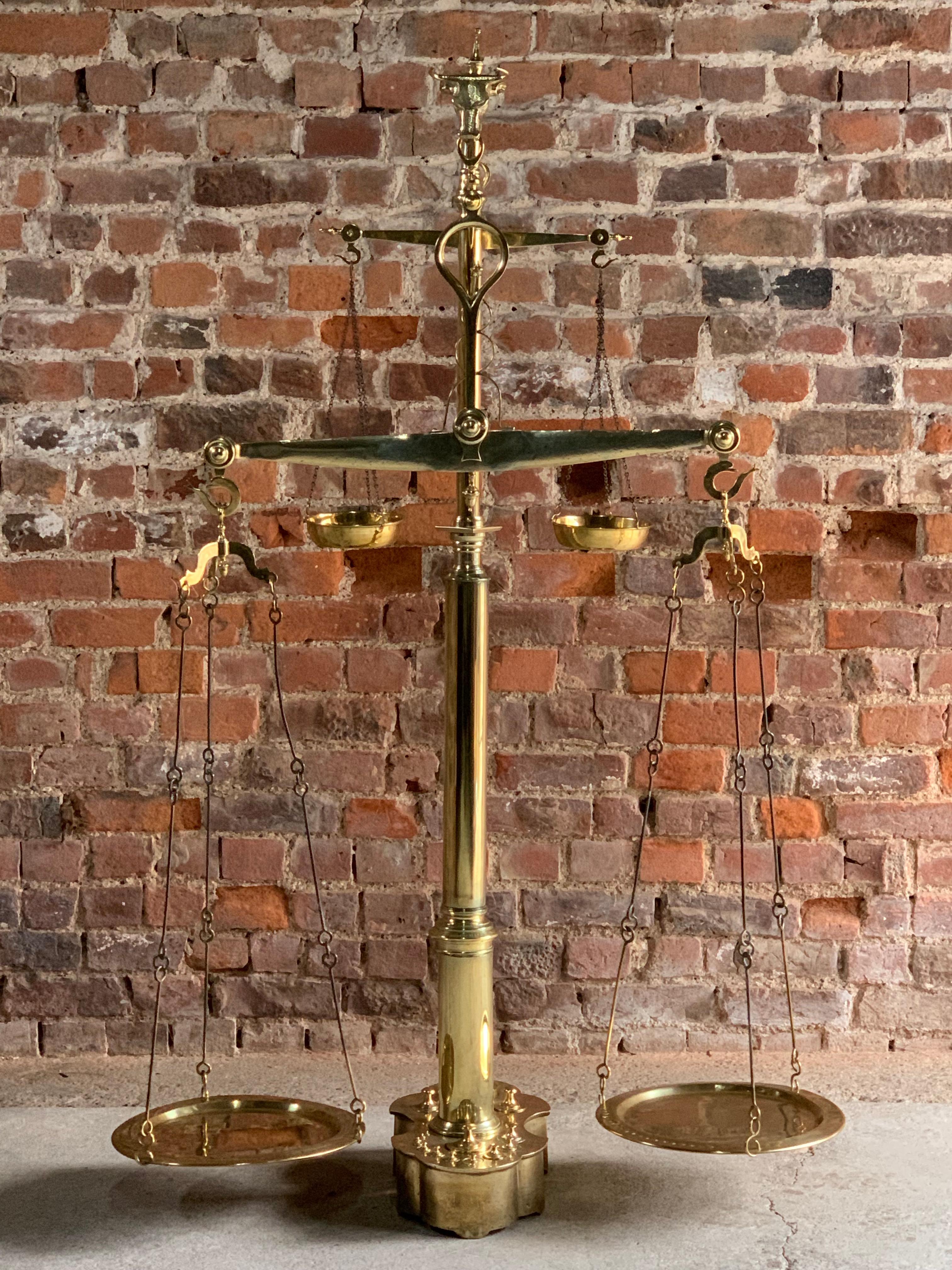 Magnificent antique brass butchers scales 19th century Portuguese, circa 1890

A magnificent set of 19th century Portuguese solid brass butcher's scales, circa 1890, this monumental et of scales comes complete with its original set of 14