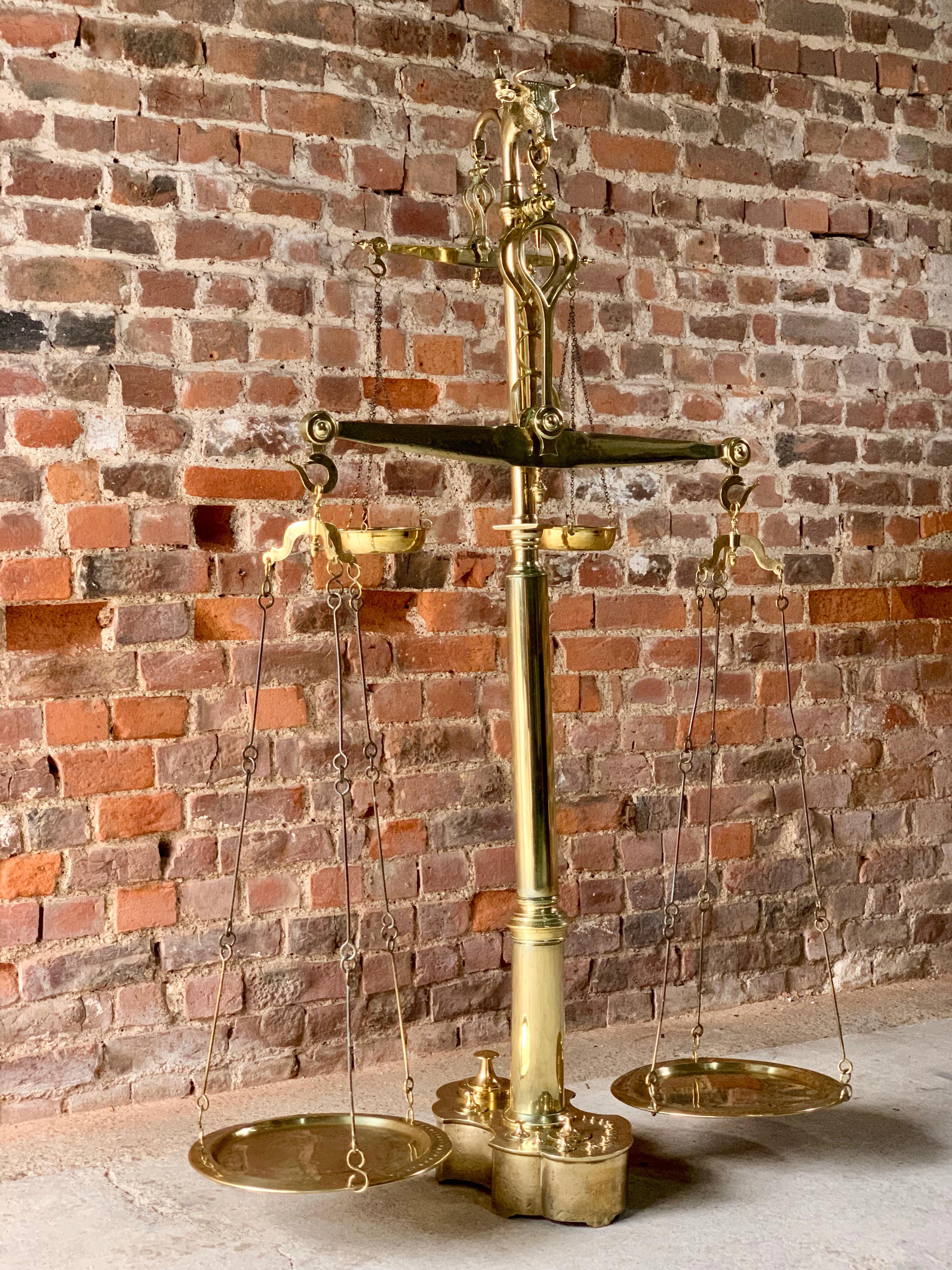 Magnificent antique brass butchers scales 19th century Portuguese, circa 1890

A magnificent set of 19th century Portuguese solid brass butcher's scales circa 1890, this monumental et of scales comes complete with its original set of 14 graduating