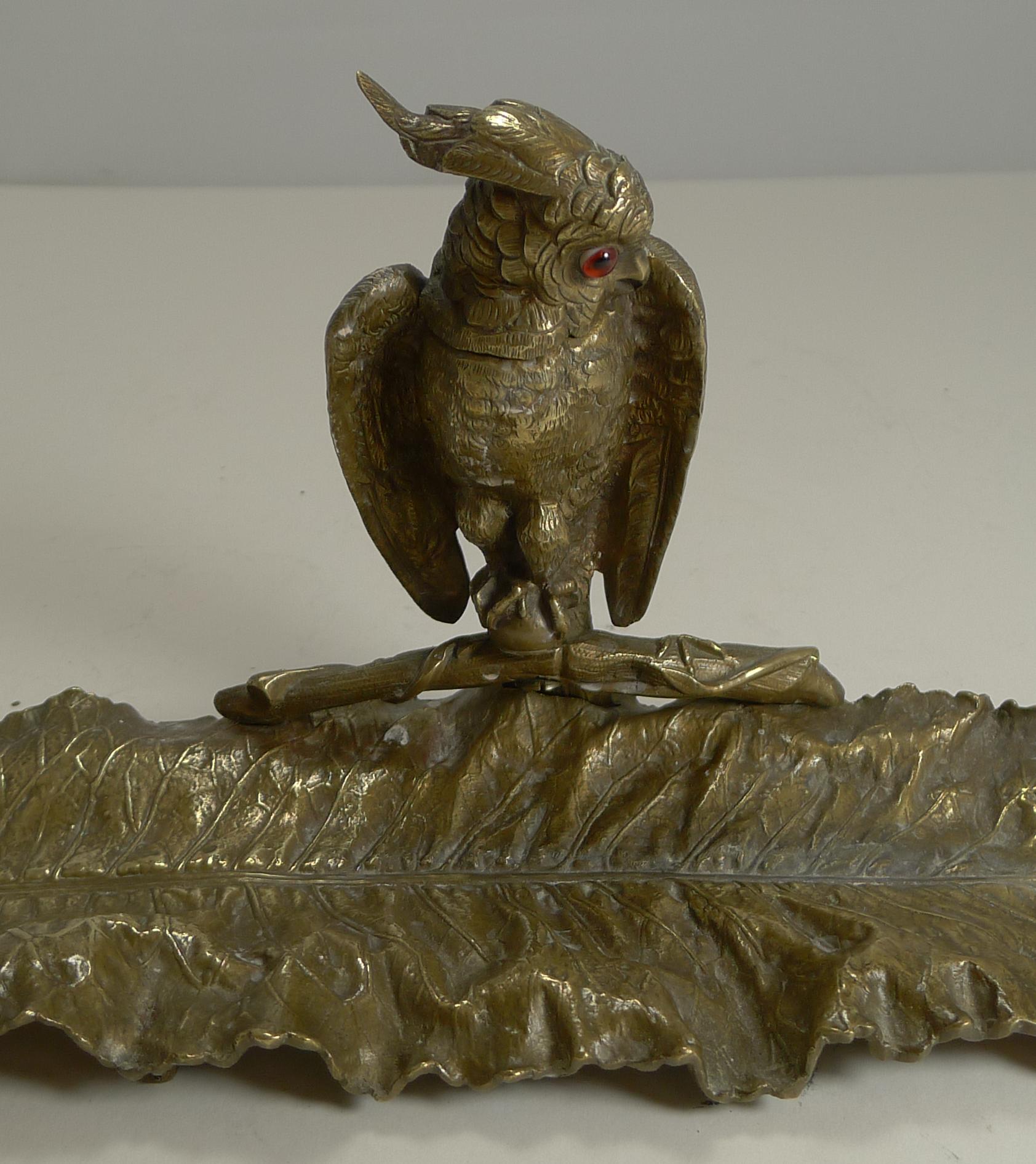 A wonderful and impressive figural inkwell made from solid cast English brass, beautifully executed with a fabulous patina.

Standing on little cast feet, the large leaf is of course a pen tray to rest one's pen. The novelty inkwell is cast in the