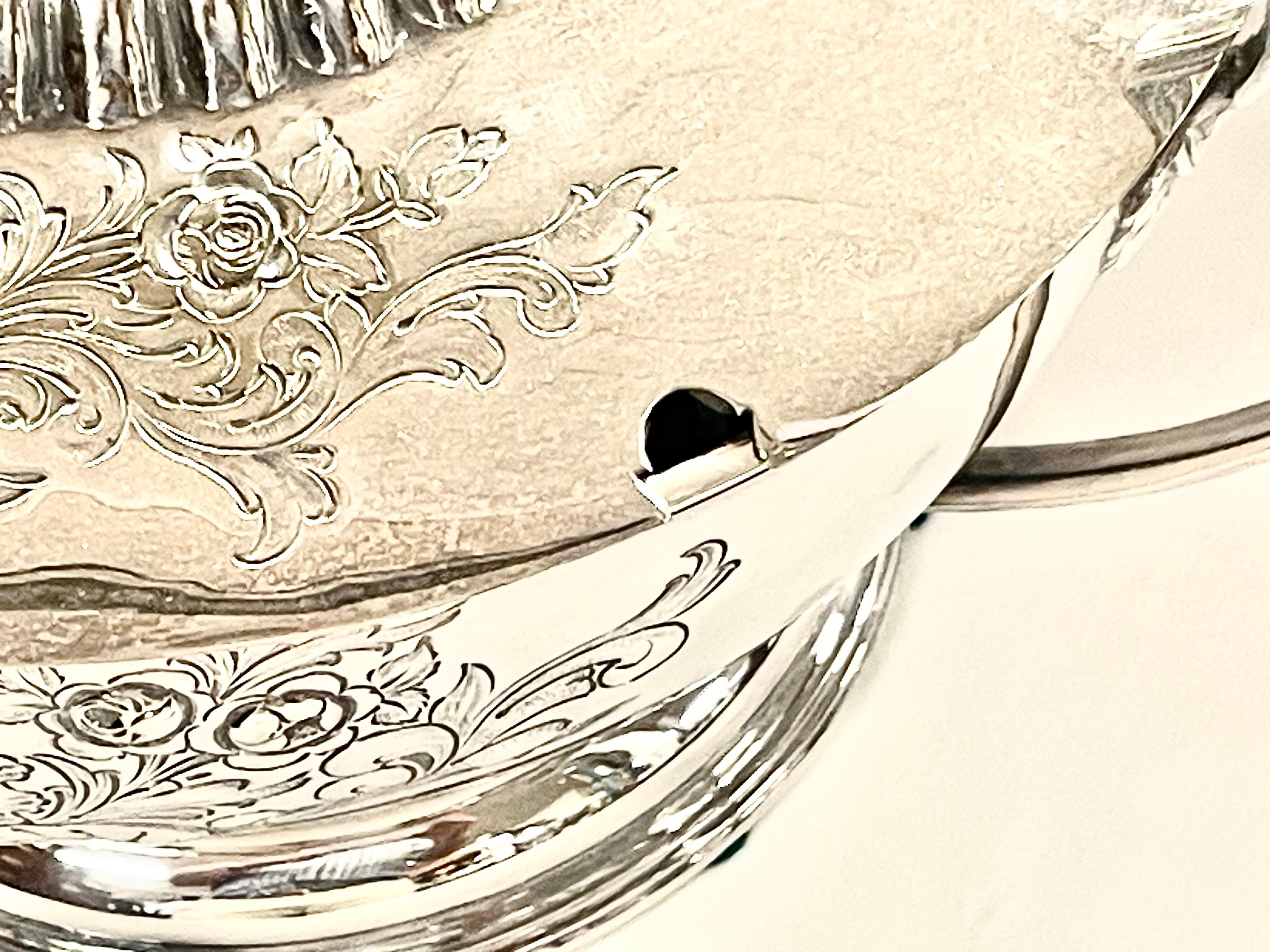 A Gorgeous Antique English Sheffield Silver Plate Hand Chased Two-Handle Soup Tureen and Lid with magnificent hand chased cartouche to the front and back that are repeated on the lid.  The cartouches are surrounded by hand chased floral and leaf