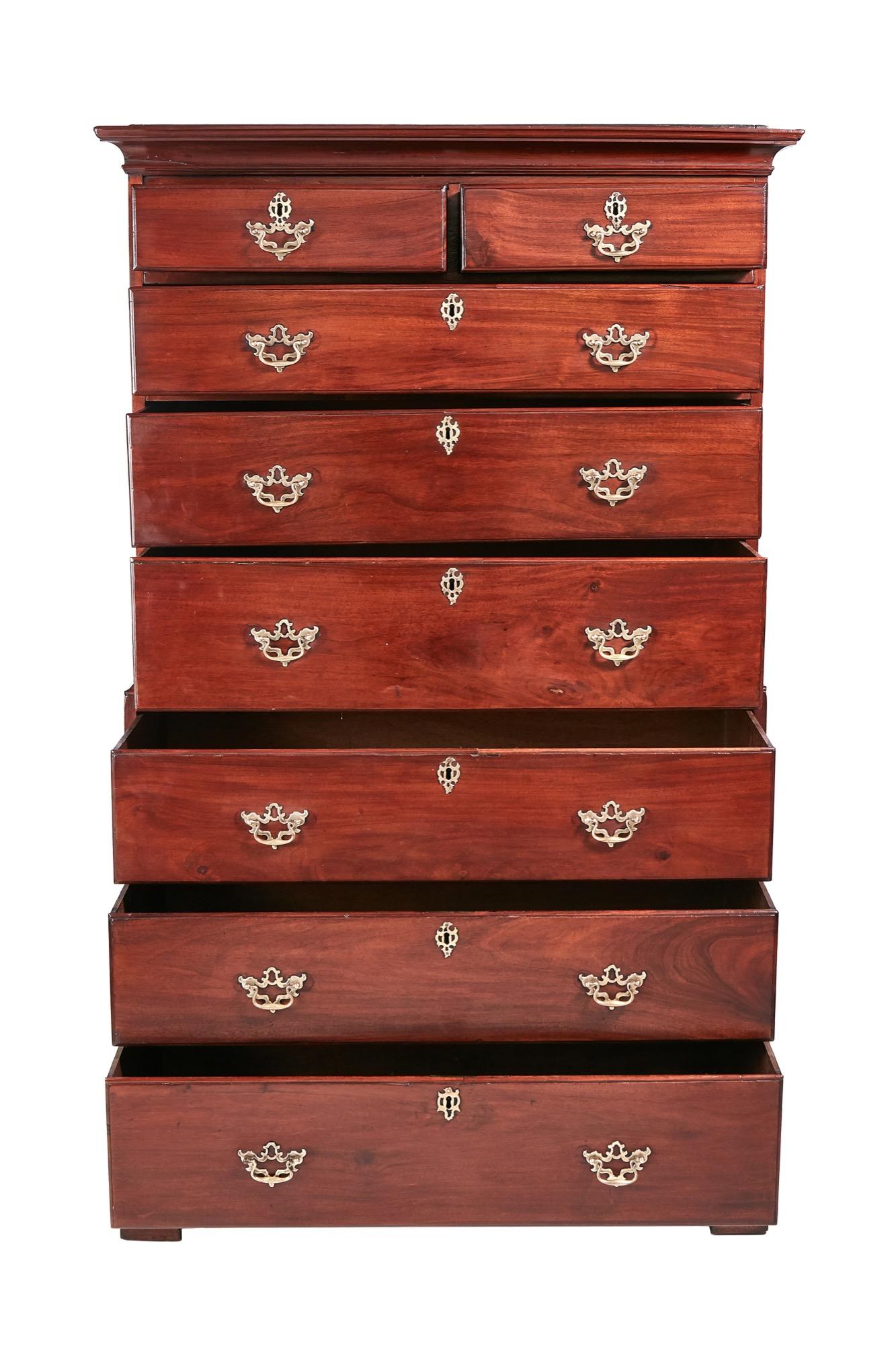 This antique George III mahogany chest on chest is a magnificent example of quality and craftsmanship from the Georgian period. It boasts a shaped moulded cornice above two short and three long graduated drawers. The base has three long drawers