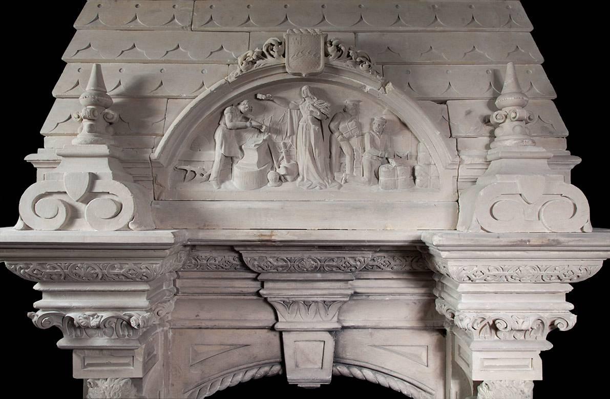 Each jamb of the fireplace has a brown bear standing on a plinth holding a heraldic shield. Above the bears are carved capitals supporting a substantial breakfront cornice shelf. The overmantel section of the fireplace has two large finials centered