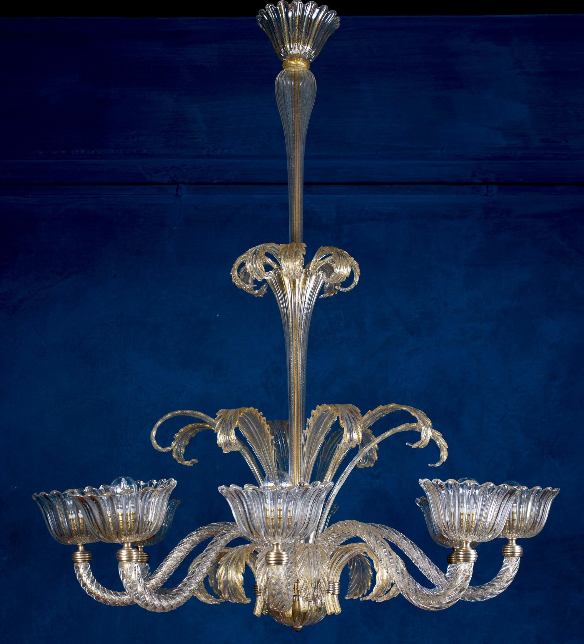 Exceptional eight-shade Murano glass chandelier with gold intrusion . Elegant shaped fine quality  brass mount, by Ercole Barovier.  Unique Art Deco beauty in excellent vintage condition.
Eight  E 27 light bulbs compatible with US standards.
 The