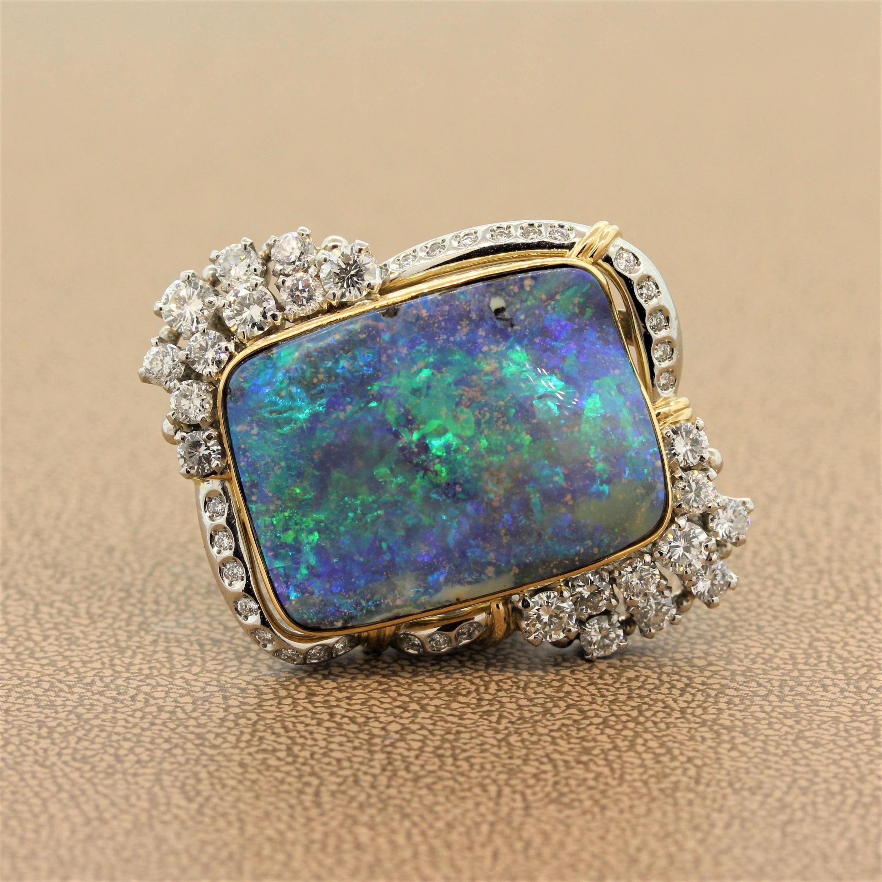 A seriously special cocktail ring featuring a large 37.73 carat boulder opal from Lightning Ridge Australian home to the finest opal in the world. The gem has fantastic play of color as it moves in the light and shows bright flashes of blue and