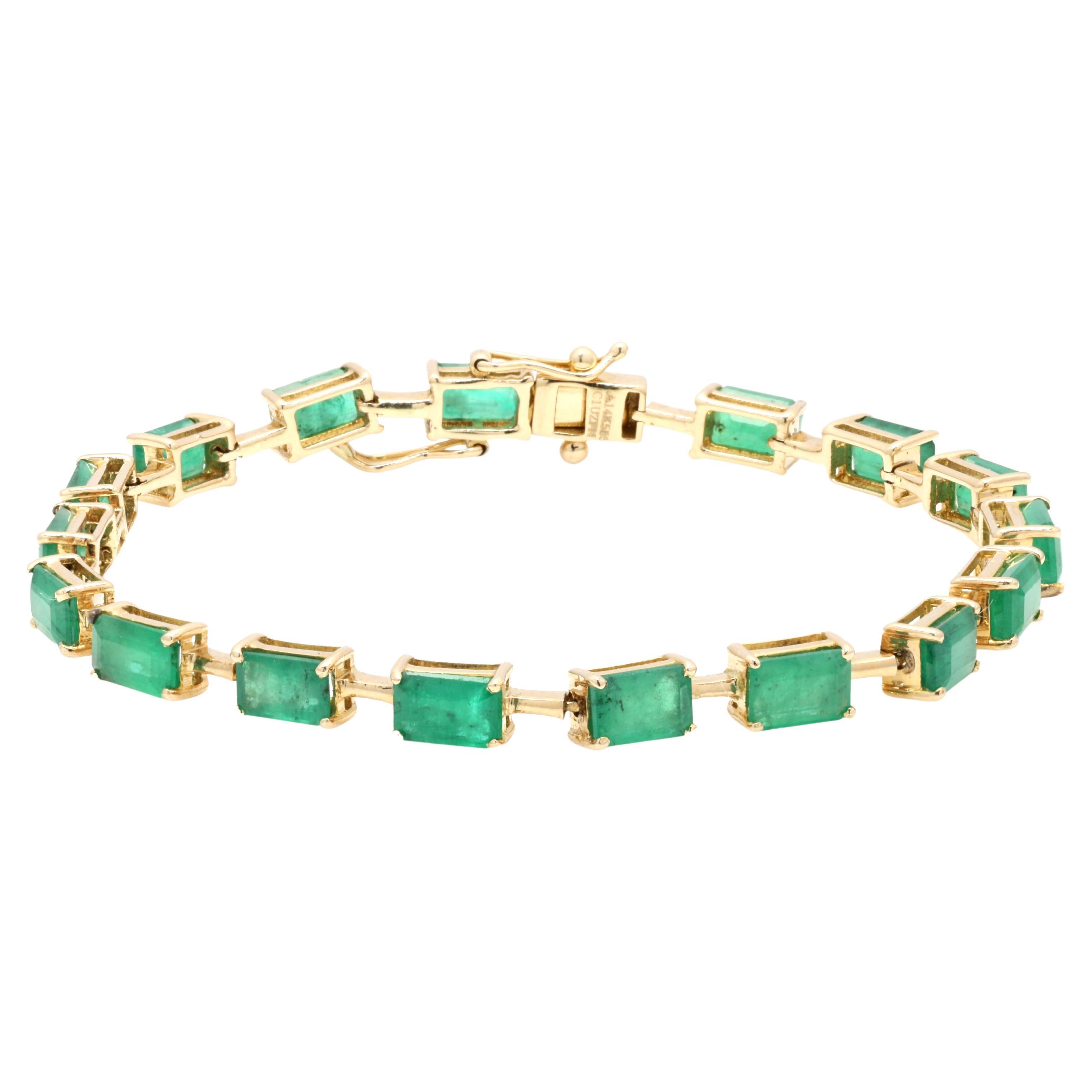 Magnifique bracelet tennis en or jaune 14 carats avec émeraude naturelle baguette de 9 carats