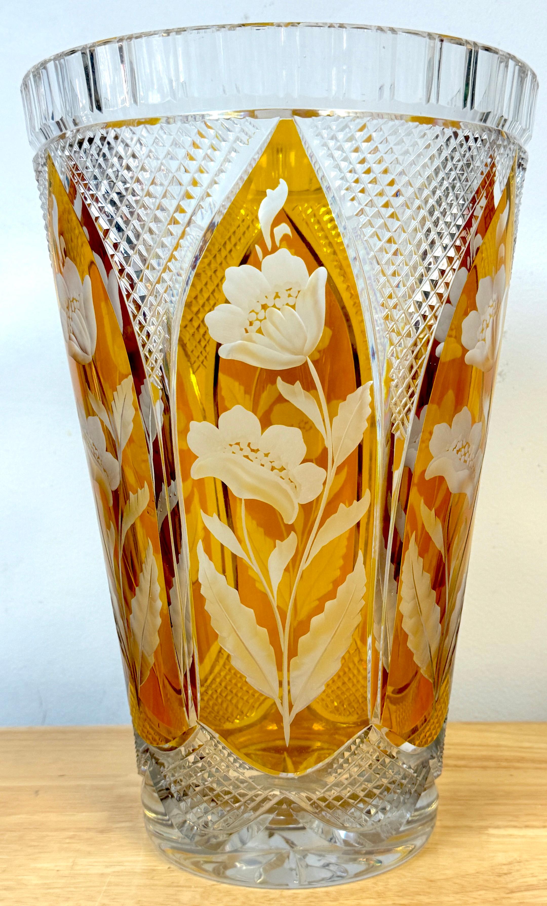 Magnificent Bohemian Engraved Citrine Cut to Clear Floral Vase
Bohemia, Czech Republic, Post WWII Circa 1950

A stunning example of craftsmanship from Bohemia, Czech Republic, circa 1950. Created in the post-WWII era, this monumental vase is