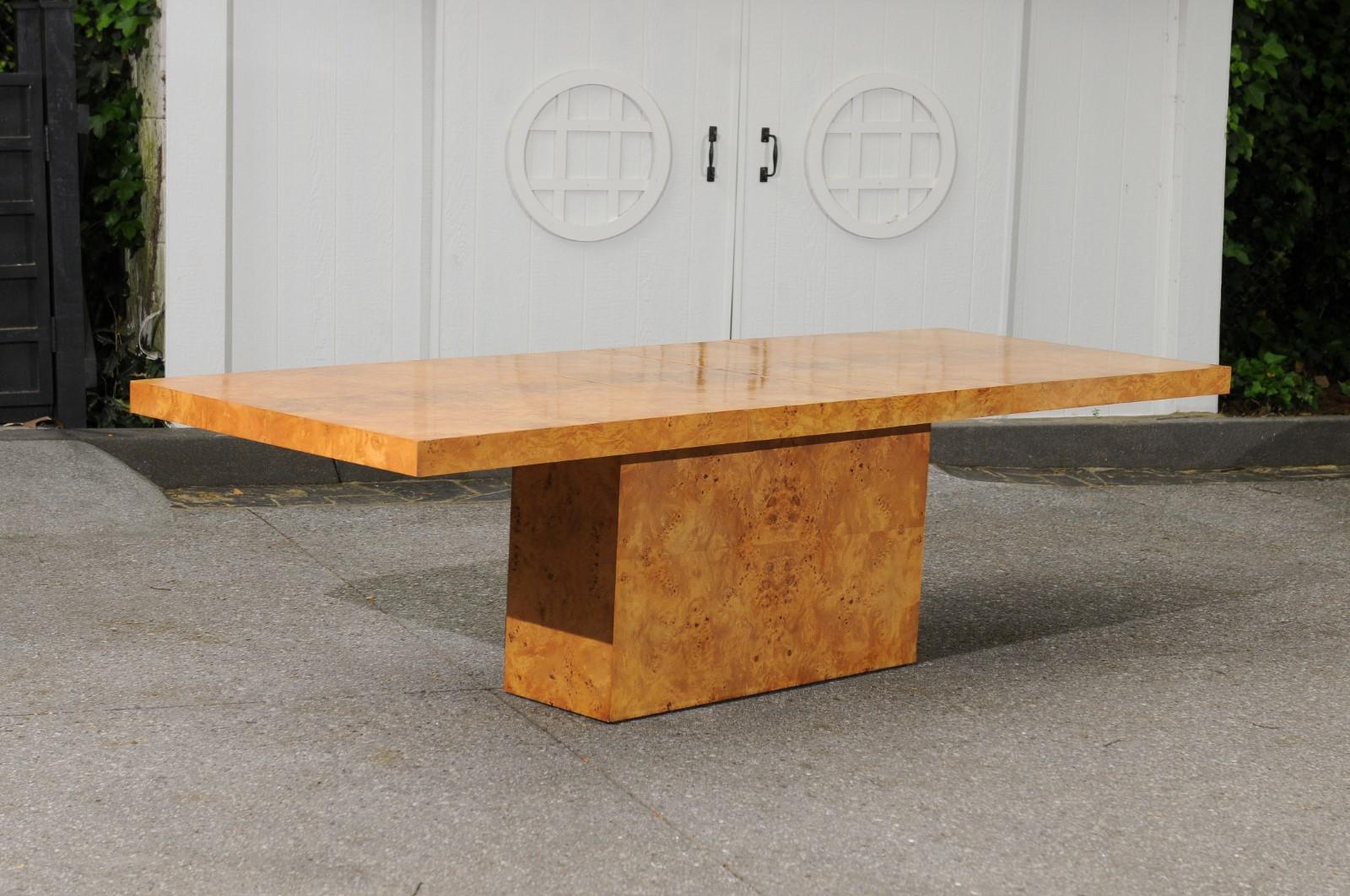 This magnificent dining table is shipped as professionally photographed and described in the listing narrative: Meticulously professionally restored and installation ready.

An exceptional single pedestal extension dining or conference table by