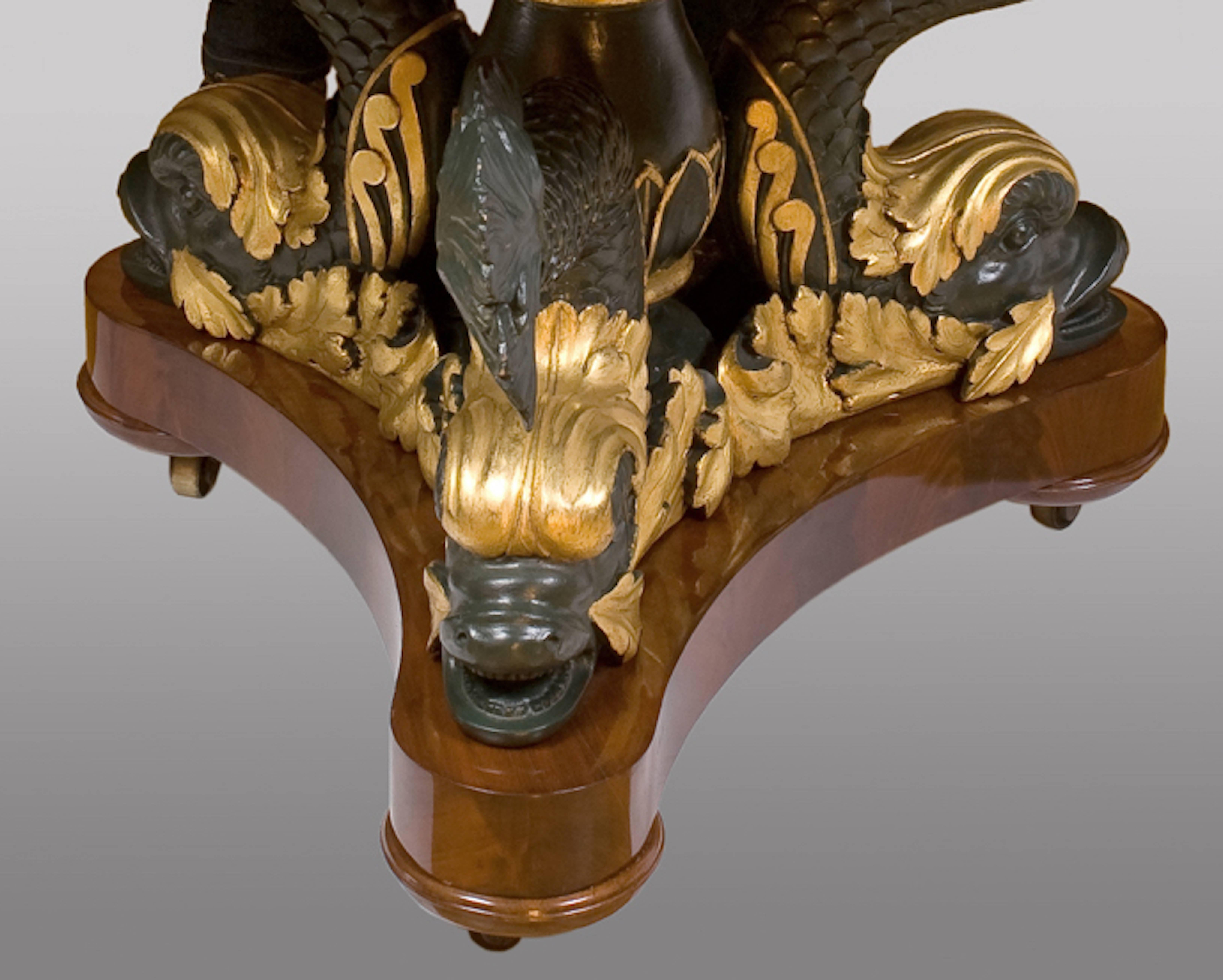 A magnificent center table. Top signed by Fratelli Blasi at Rome in 1827
Marble top.
Supported by three carved dolphins.

 
