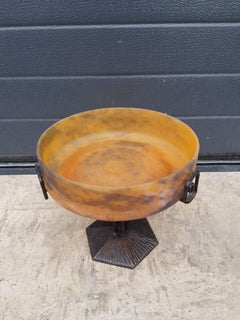 Magnificent circular bowl set in a wrought-iron frame