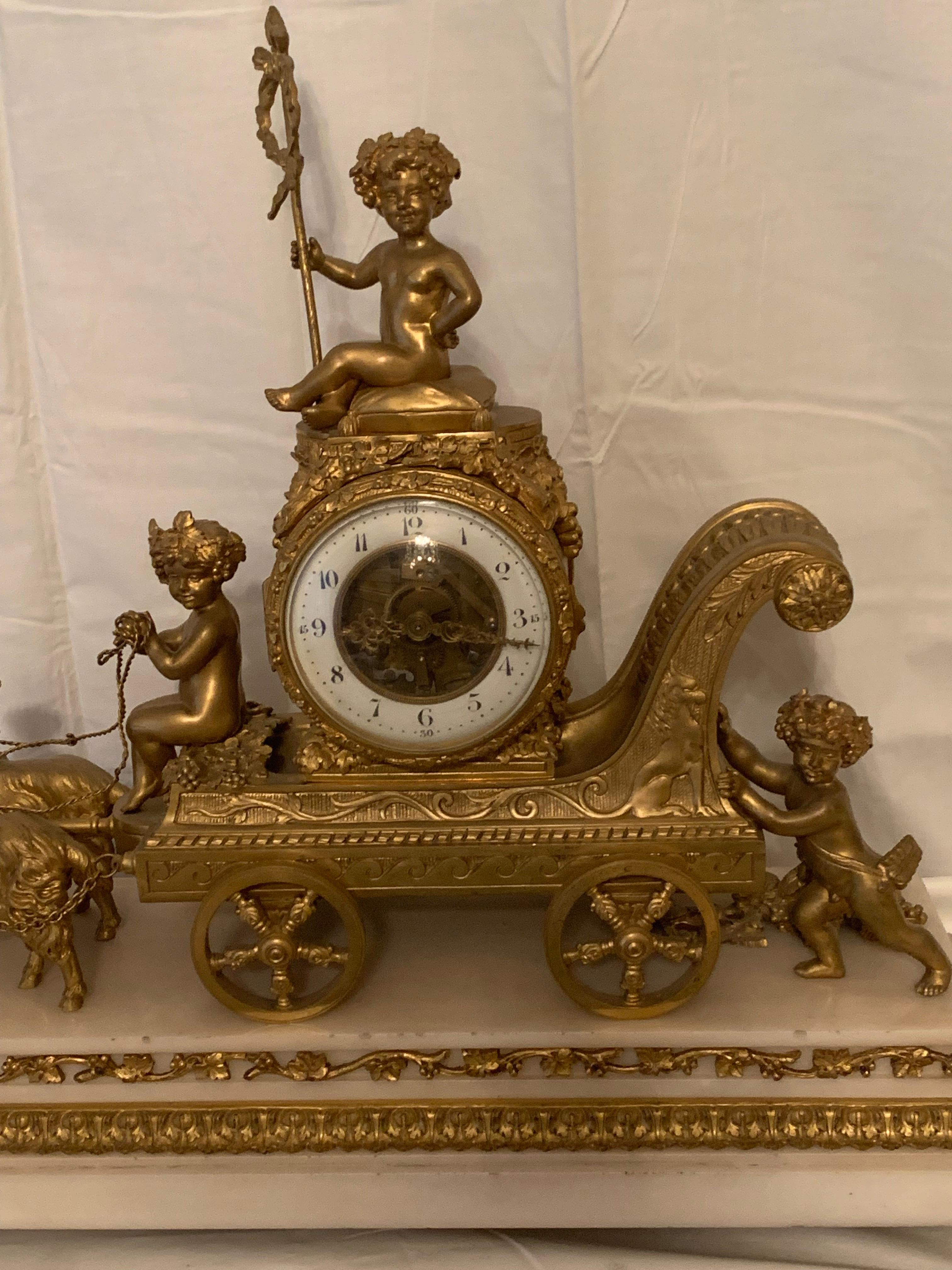 Louis XVI Magnificent 19th Century clock in bronze with cupids pulling a chariot by rams For Sale