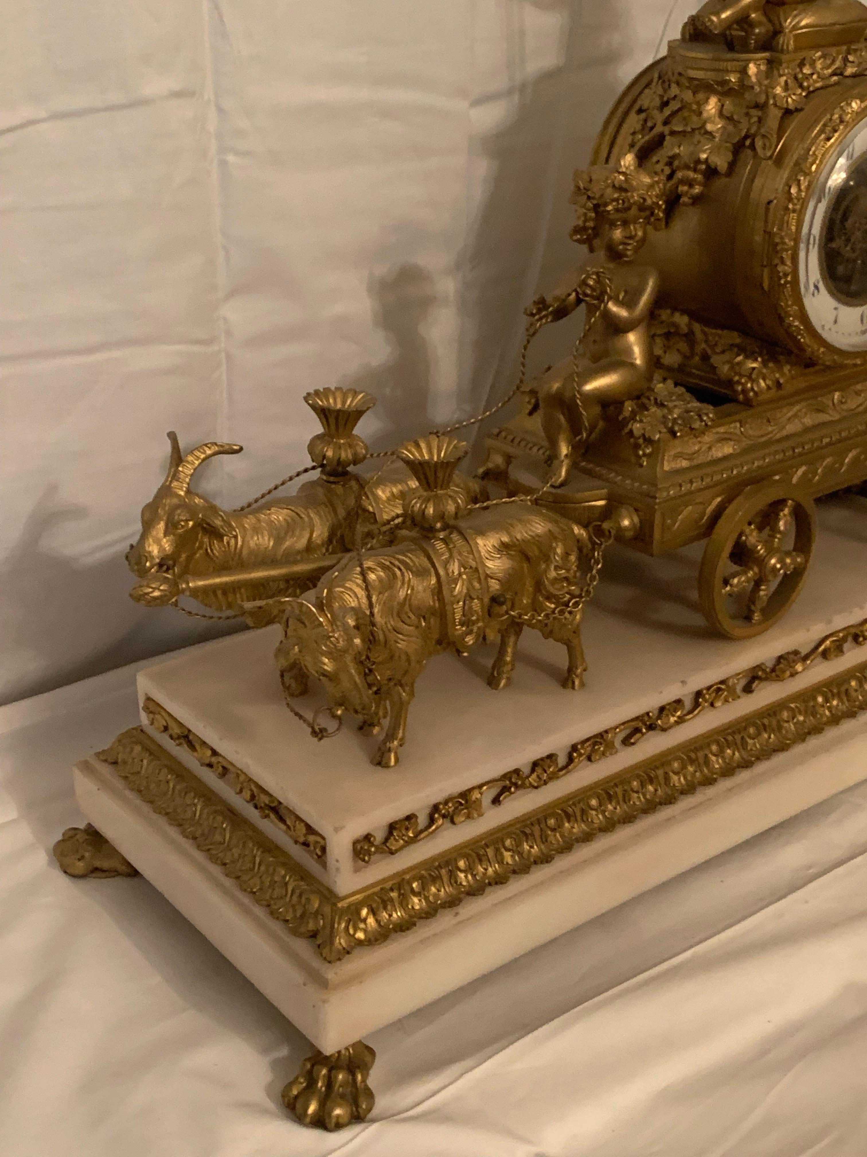 French Magnificent 19th Century clock in bronze with cupids pulling a chariot by rams For Sale