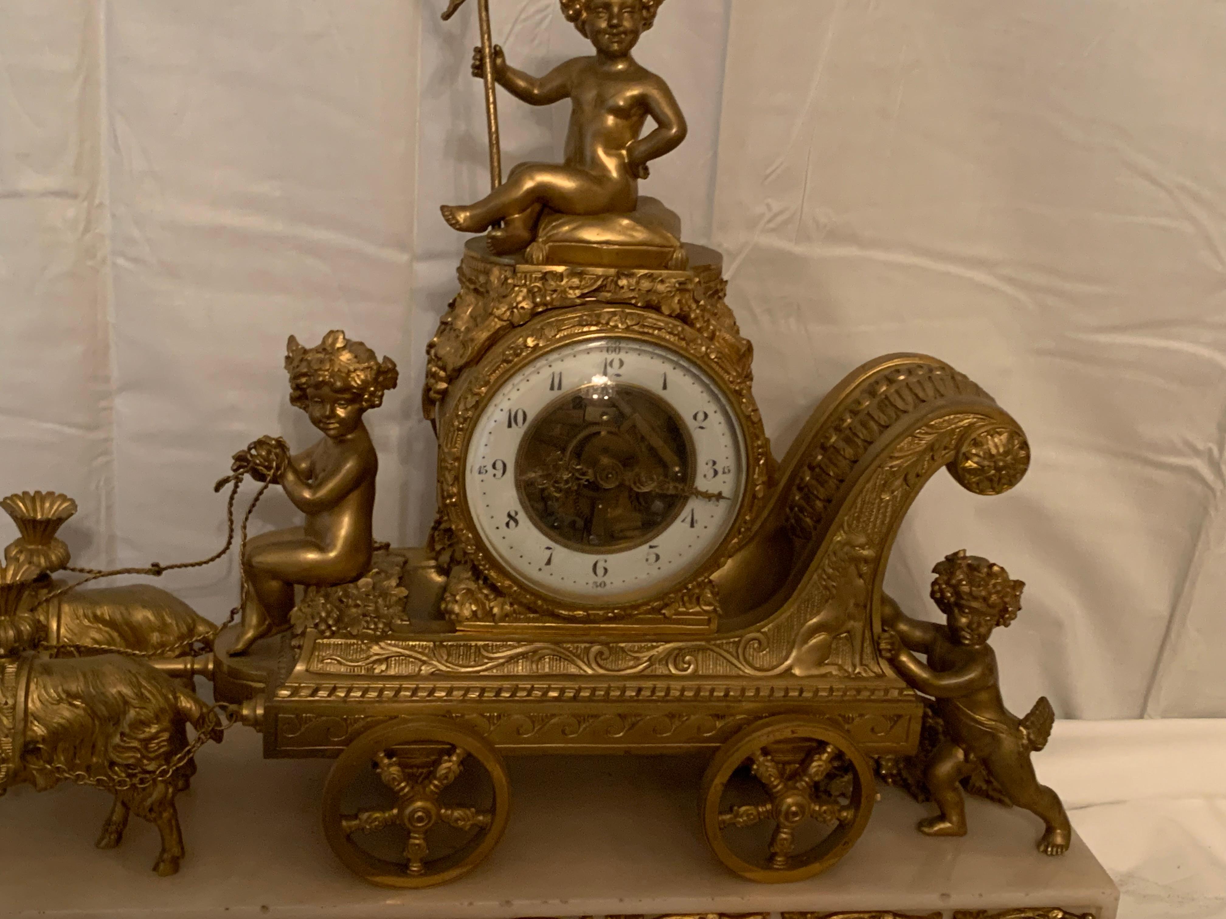 Magnificent 19th Century clock in bronze with cupids pulling a chariot by rams In Good Condition For Sale In Los Angeles, CA