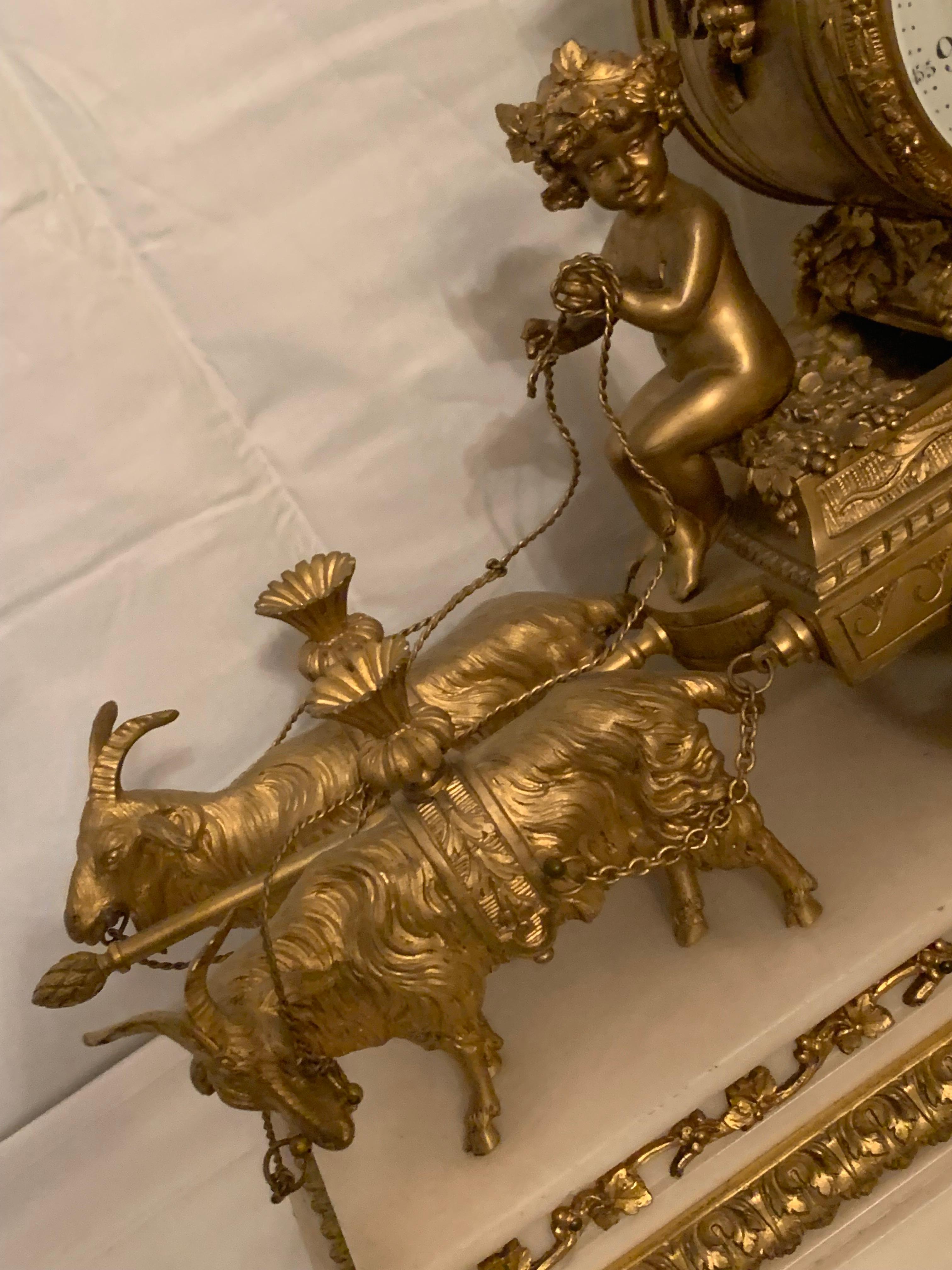 Bronze Magnificent 19th Century clock in bronze with cupids pulling a chariot by rams For Sale
